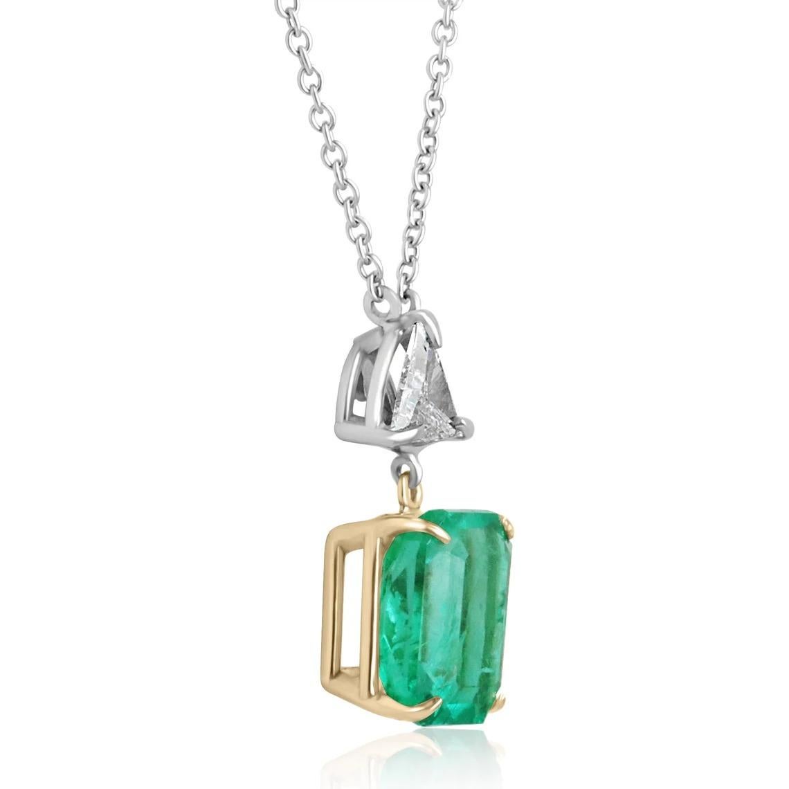 A fine quality Colombian emerald, classic emerald-cut, and trillion diamond necklace. The glowing emerald carries a full 5.12 carat, incandescent Muzo green earth-mined emerald. The stone displays excellent luster and very good eye clarity with