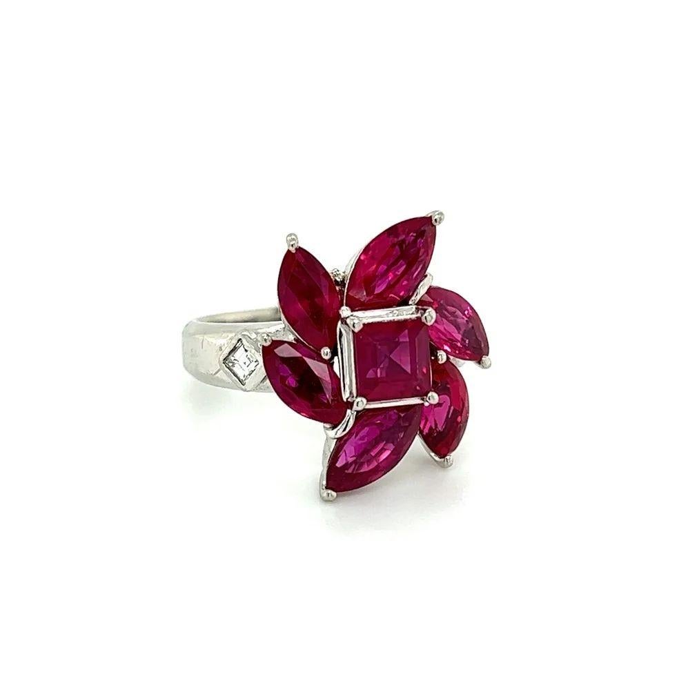 Simply Beautiful! Finely detailed Natural Red Rubies GIA and Diamond Platinum Vintage Cocktail Ring. Centering a securely nestled Hand set Square Red Ruby GIA, weighing 5.73 Carats. GIA #6224817257. Surrounded by 6 Marquis Rubies and Square Step-cut