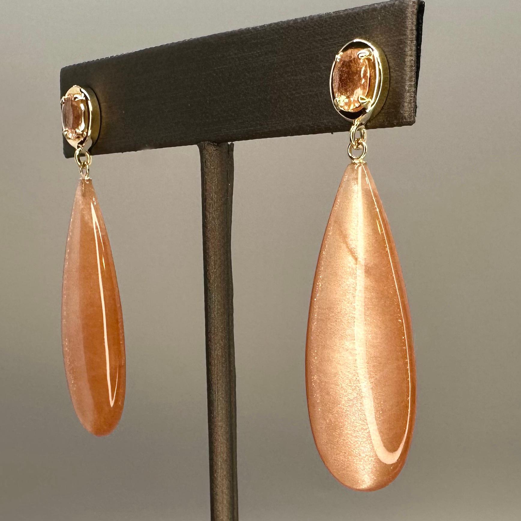 57.43k Tanzanian sunstone drop, oval cut sunstone, and 14k yellow gold earrings In New Condition For Sale In Seattle, WA