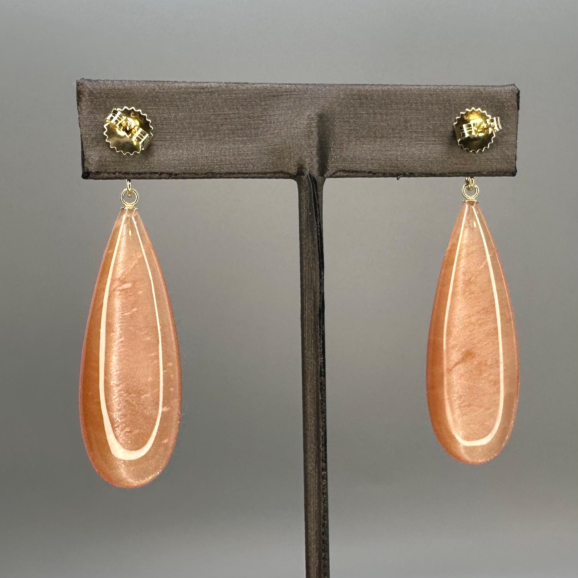 57.43k Tanzanian sunstone drop, oval cut sunstone, and 14k yellow gold earrings For Sale 3