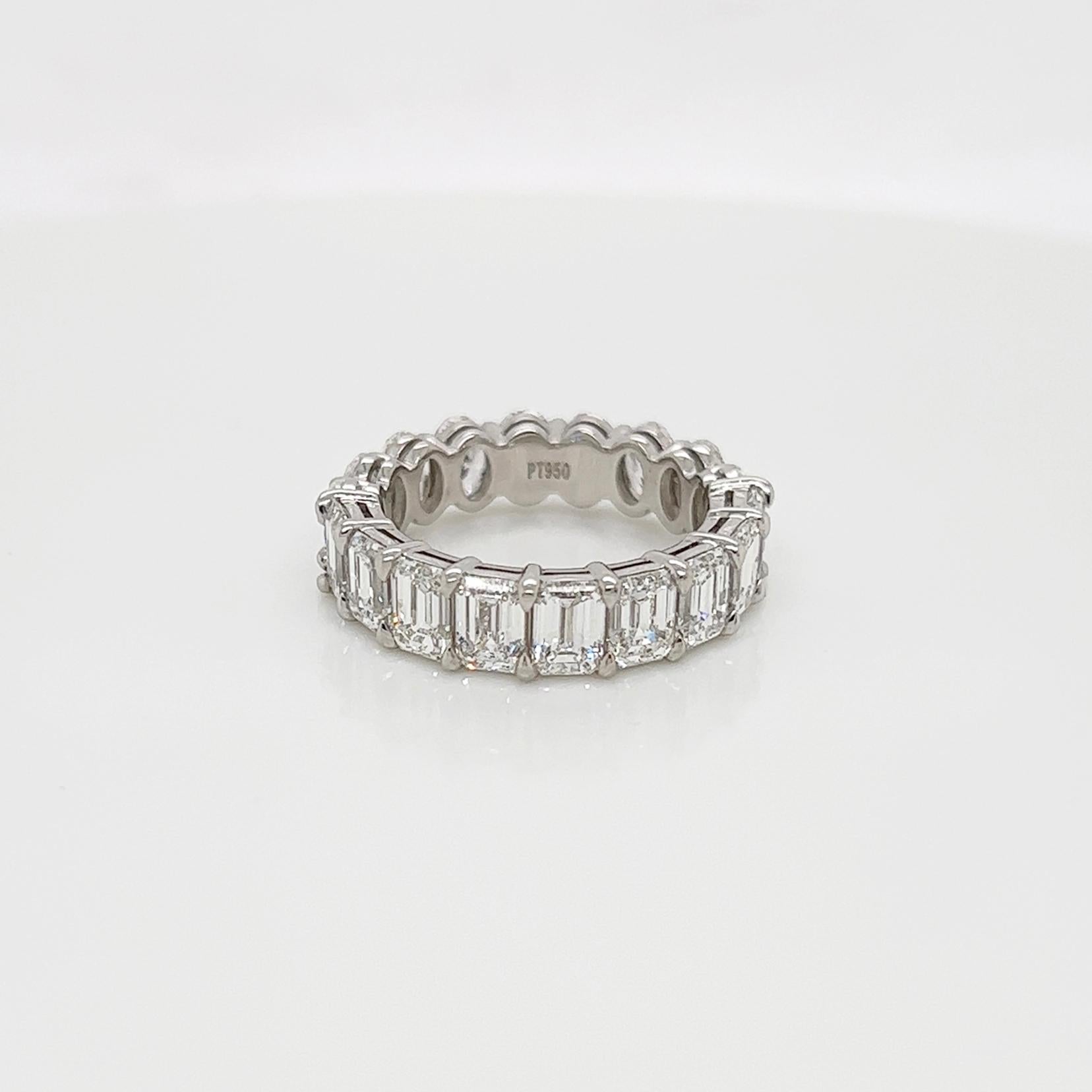 Ladies diamond mixed shape Eternity band carries 5.74 Total Carat of oval and emerald diamonds placed in platinum.

Size: 6.0
Color: G-H
Clarity: VS

This shared prong style Eternity band was handmade by our jewelers in New York City.