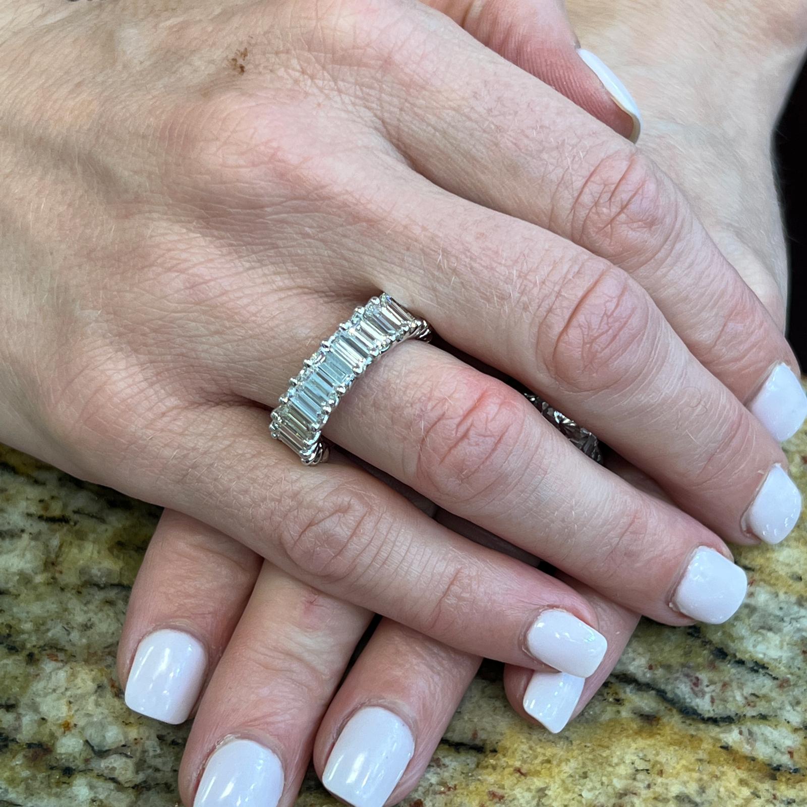 Stunning baguette diamond band handcrafted in 18 karat white gold. The ring features 17 baguette cut diamonds weighing 5.75 carat total weight and graded H color and VS clarity. The diamonds are set in a 'U' prong mounting, and the diamonds go 3/4