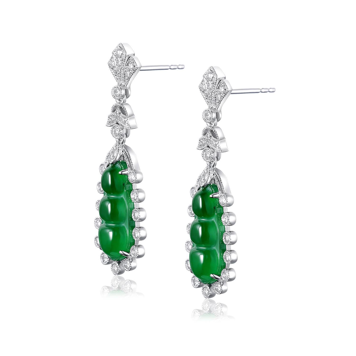 These captivating platinum earrings are a harmonious blend of tradition and modern elegance. Crafted with 18-karat white gold backs, these earrings exude a timeless appeal. The central feature is a pair of stunning 3.13-carat jade gemstones,