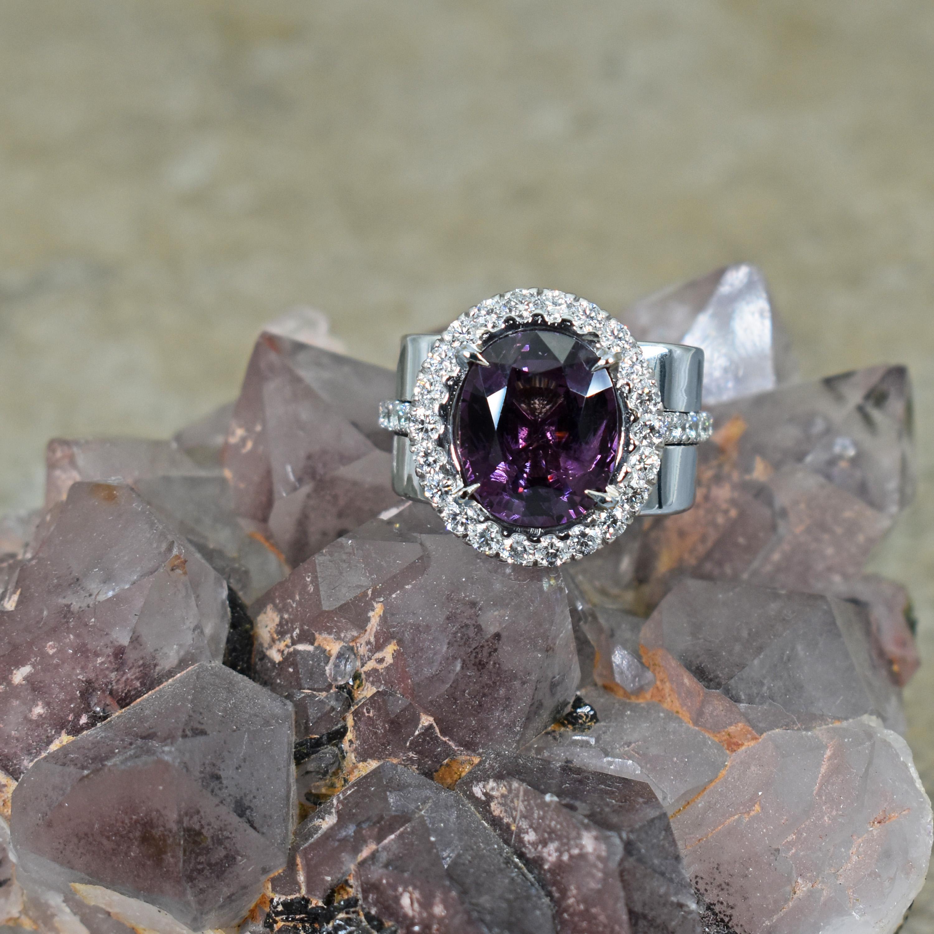 5.75 carat oval-cut regal Purple Spinel and white Diamond (1.11 carat total weight; G-H, SI3-I1) halo 14k white gold cocktail ring. Ring is size 7. Tapered white gold band ranges from 9mm to 12mm at widest point. Setting and stone sits 7mm tall off