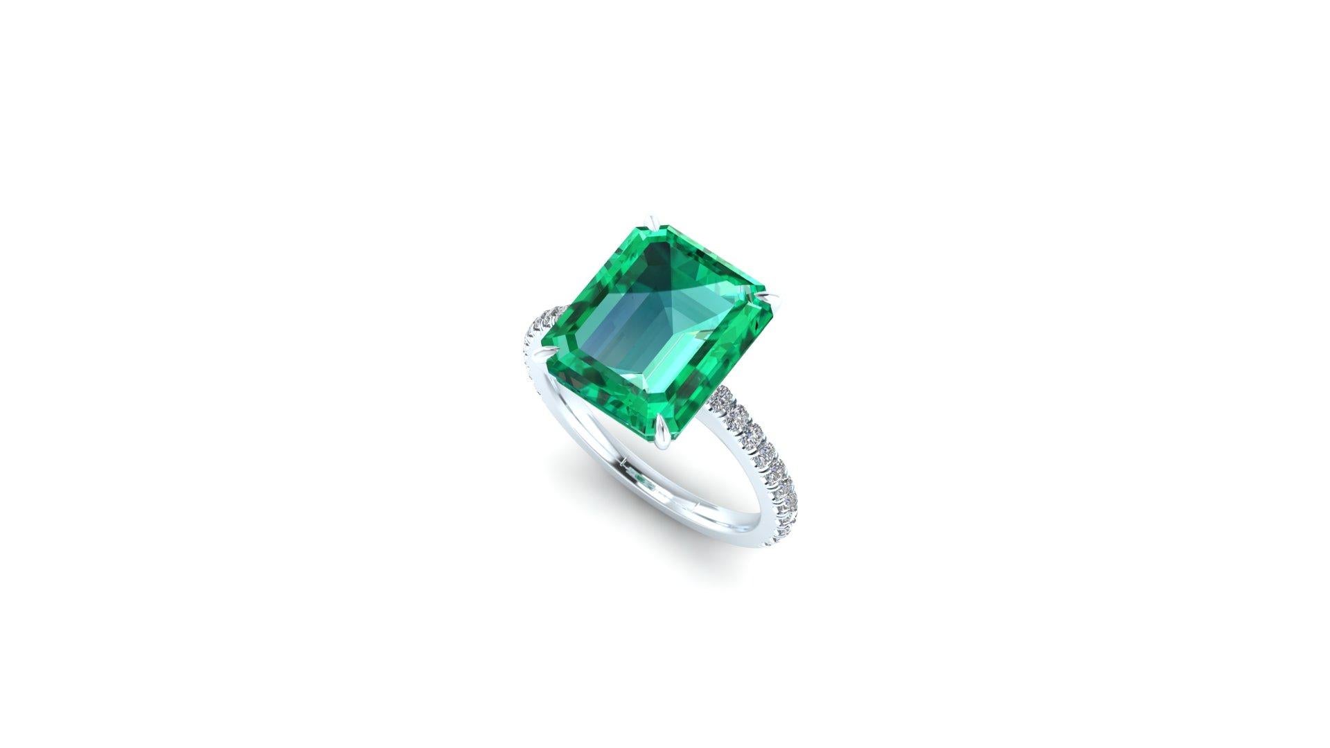 5.75 ct Emerald, GIA Certified stunning clean mineral, with only a few natural inclusions typical of the Emerald. 
Pave' diamonds set with microscope for high end detailing, for an approximate carat weight of 0.30 carats, G color, Vs clarity.
Made