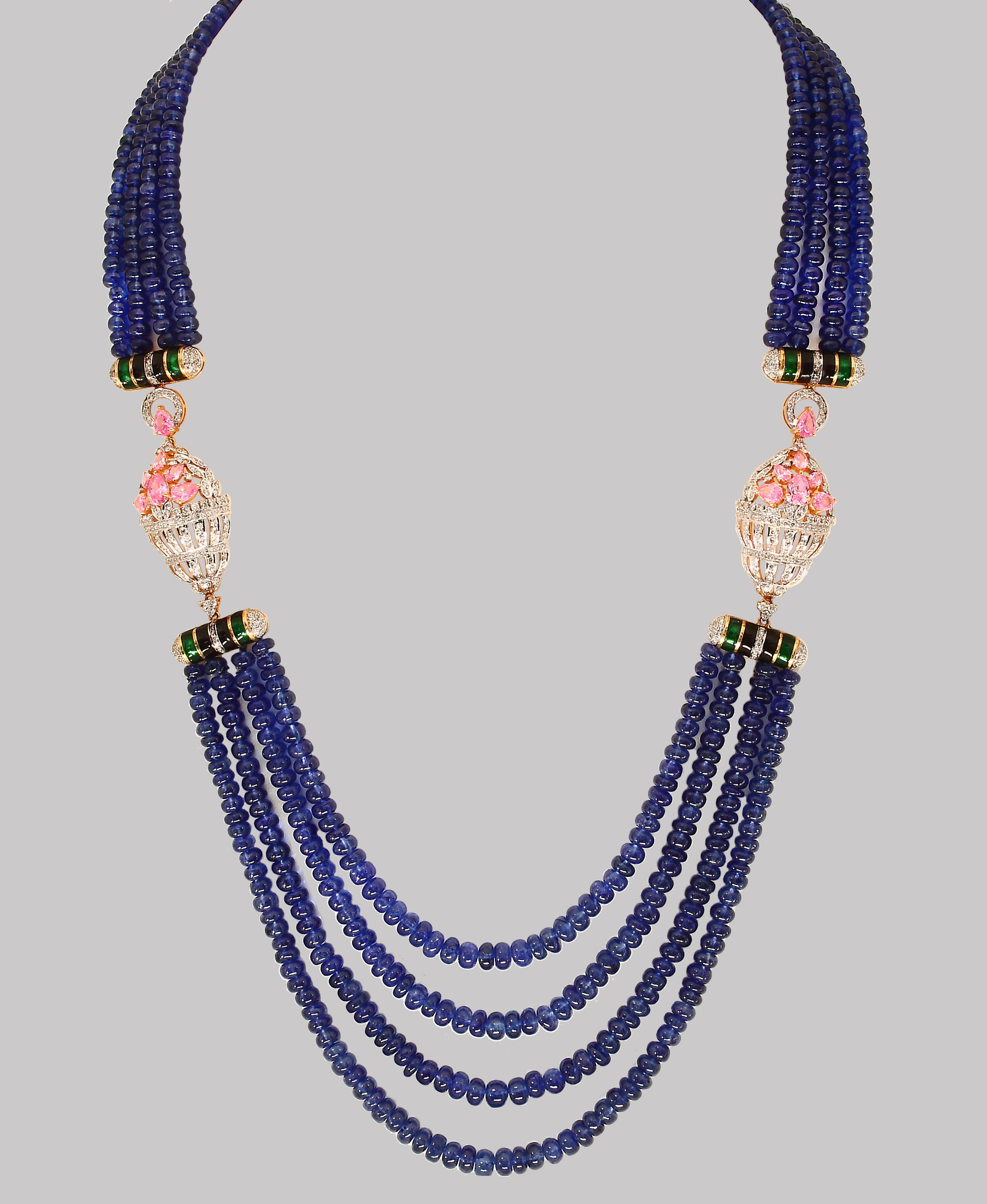  575 Ct Natural Tanzanite Bead Four Strand Necklace With 6.5 carats of Diamond in 14 Karat Yellow  Gold
All natural beads , no color enhancement
Opera Length
Back Gold clasp is such that you can adjust the length of the necklace  
4 layers of