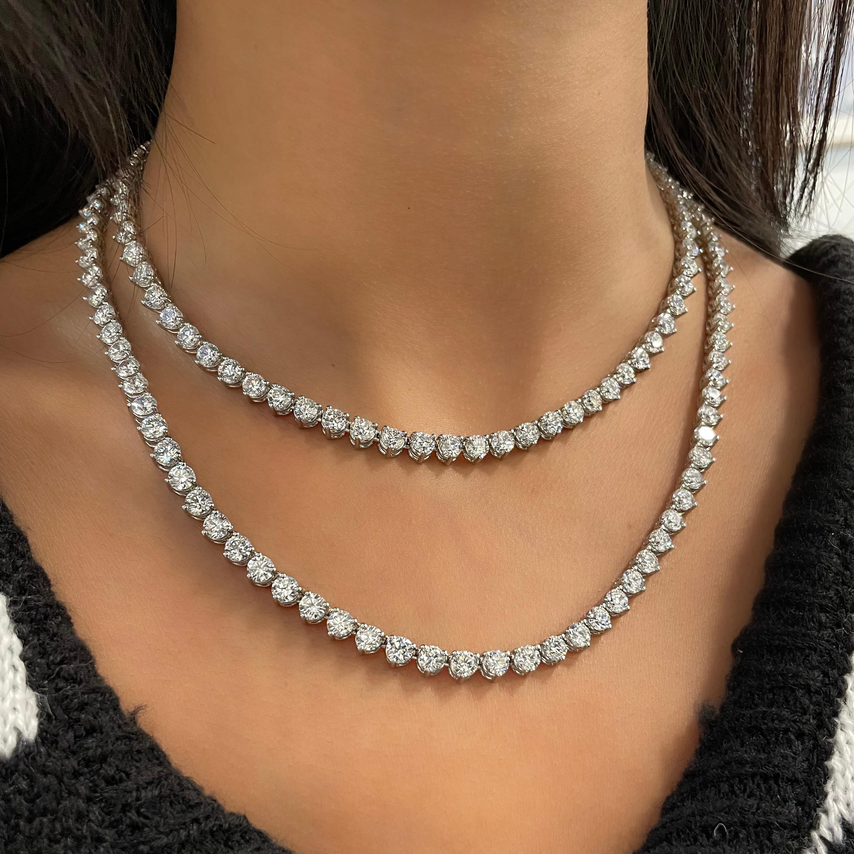 Platinum 32 inch 3-prong diamond opera neckalce. The necklace features 173 round brilliant cut diamonds weighing 57.52 cts and graded G-H in color and SI1-SI2 in clarity. 