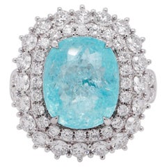 5,76 : Bague classique sertie d'un diamant certifié « Paraíba néon » du Mozambique, accompagné de diamants blancs