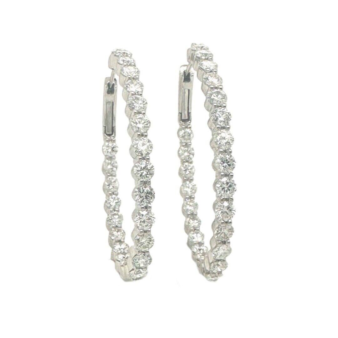 Style: Hoop Earrings

Metal: White Gold

Metal Purity: 18k

Stones: 48 Round Diamonds (24 each hoop)

Diamond Carat Weight: approx. 5.76 ct

Diamond Clarity: VS1 - VS2

Diamond Color: G - H

Hoop Length: 3.9 cm

Hoop Width: 3.2 cm

Total Weight