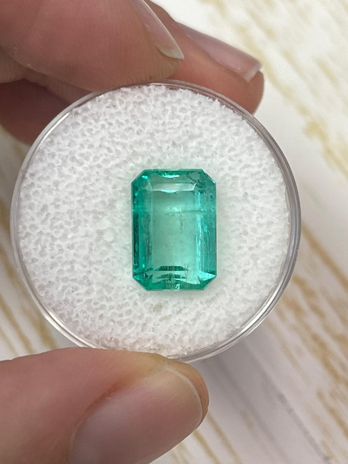 Stone: Emerald
Weight: 5.76-carats
Shape: Emerald Cut
Clarity: Transparent
Luster: Very Good
Color: Medium Light Green
Measurements: 11.94mm x 8.31mm x 6.28mm
Geographic Origin: Colombia
Treatment: Natural, Oiling

Comments: Due to their growth