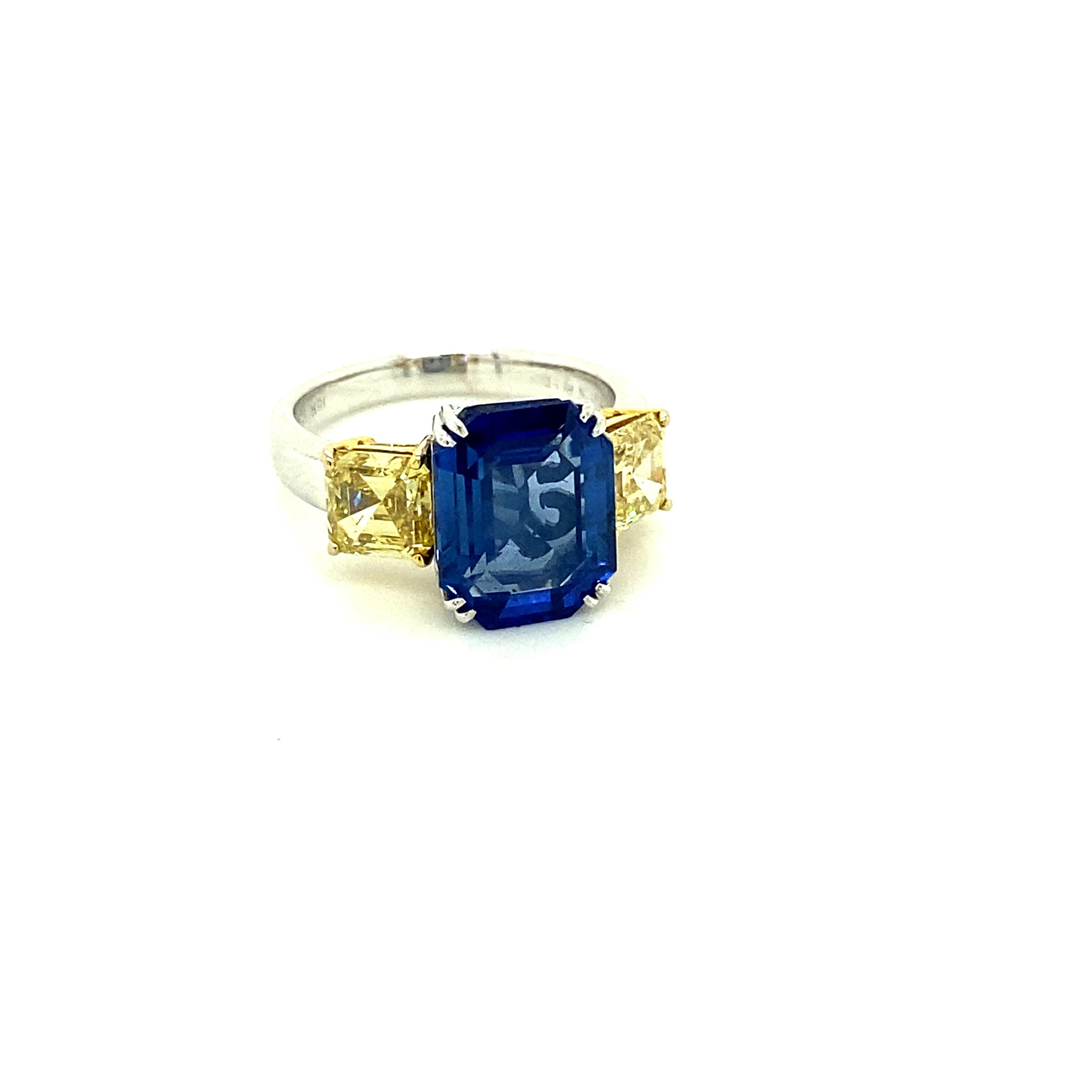 5.77 Carat GIA Certified Blue Sapphire and Fancy Yellow Diamonds Gold Ring:

A beautiful ring, it features a GIA certified octagon-cut shaped blue sapphire weighing 5.77 carat with GIA certified fancy yellow diamond and fancy deep yellow diamond on