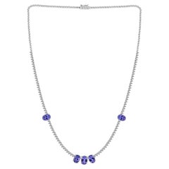 Collana “tennis” con tanzanite naturale da 5,77 ct e diamanti da 2,75 ct, in oro bianco 18 carati