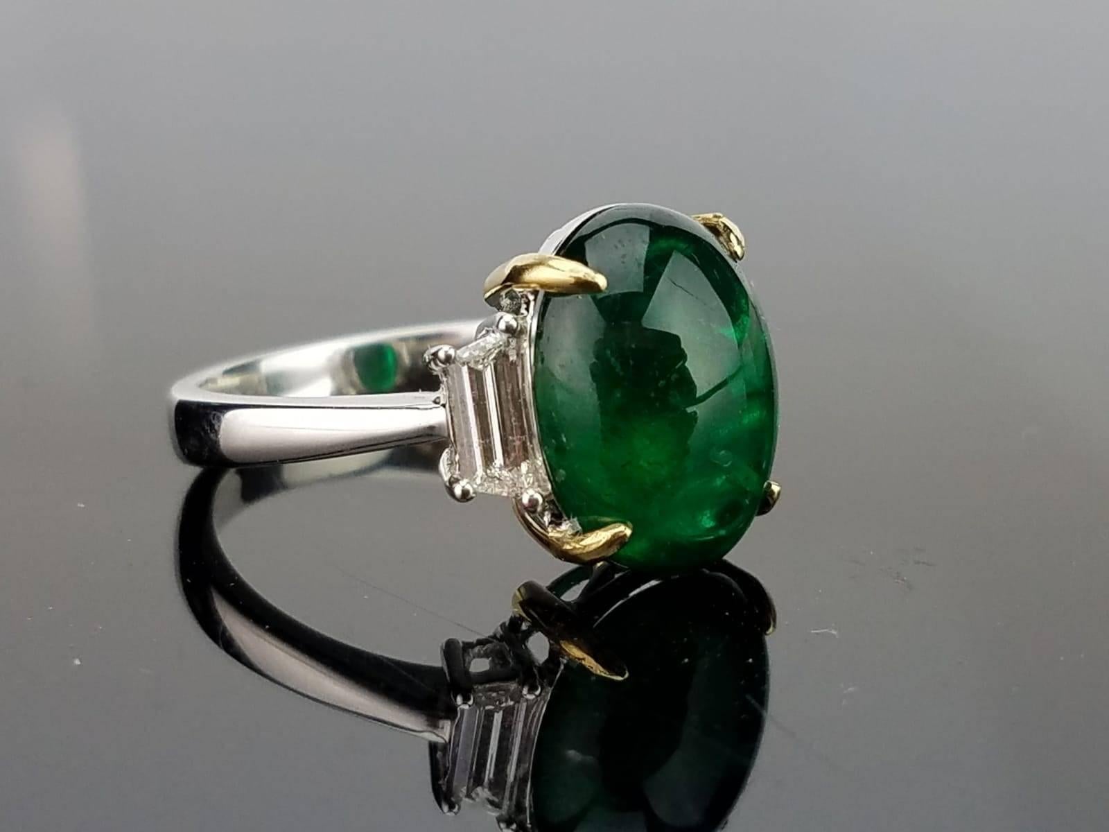 A classic three stone ring, with a 5.78 carat lustrous and deep coloured Zambian Emerald centre stone and 2 baguette side stone diamonds. 

Stone Details: 
Stone: Zambian Emerald
Carat Weight: 5.78 Carats

Diamond Details: 
Total Carat Weight: 0.38