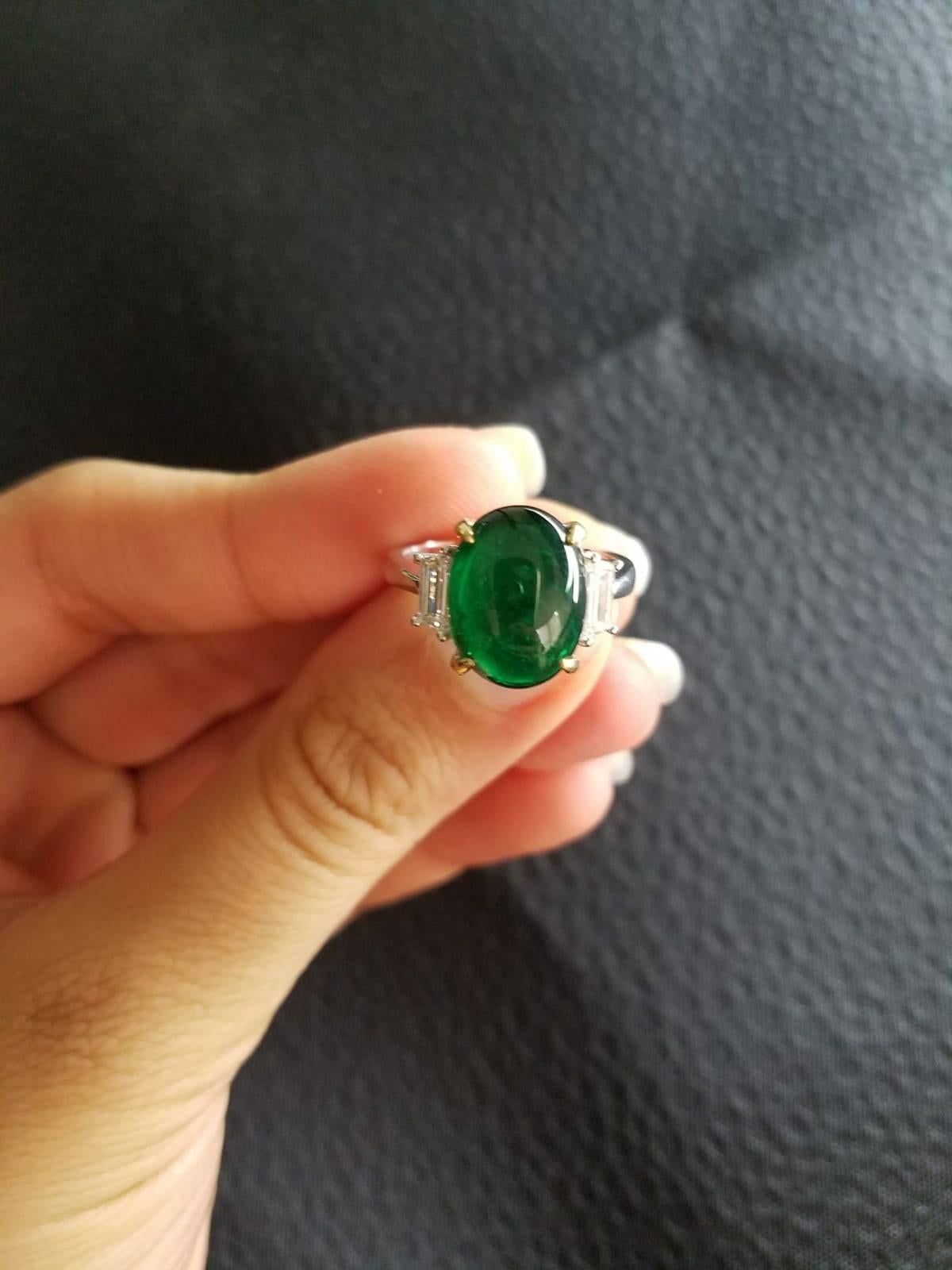 Oval Cut 5.78 Carat Emerald Cabochon and Diamond Three-Stone Ring