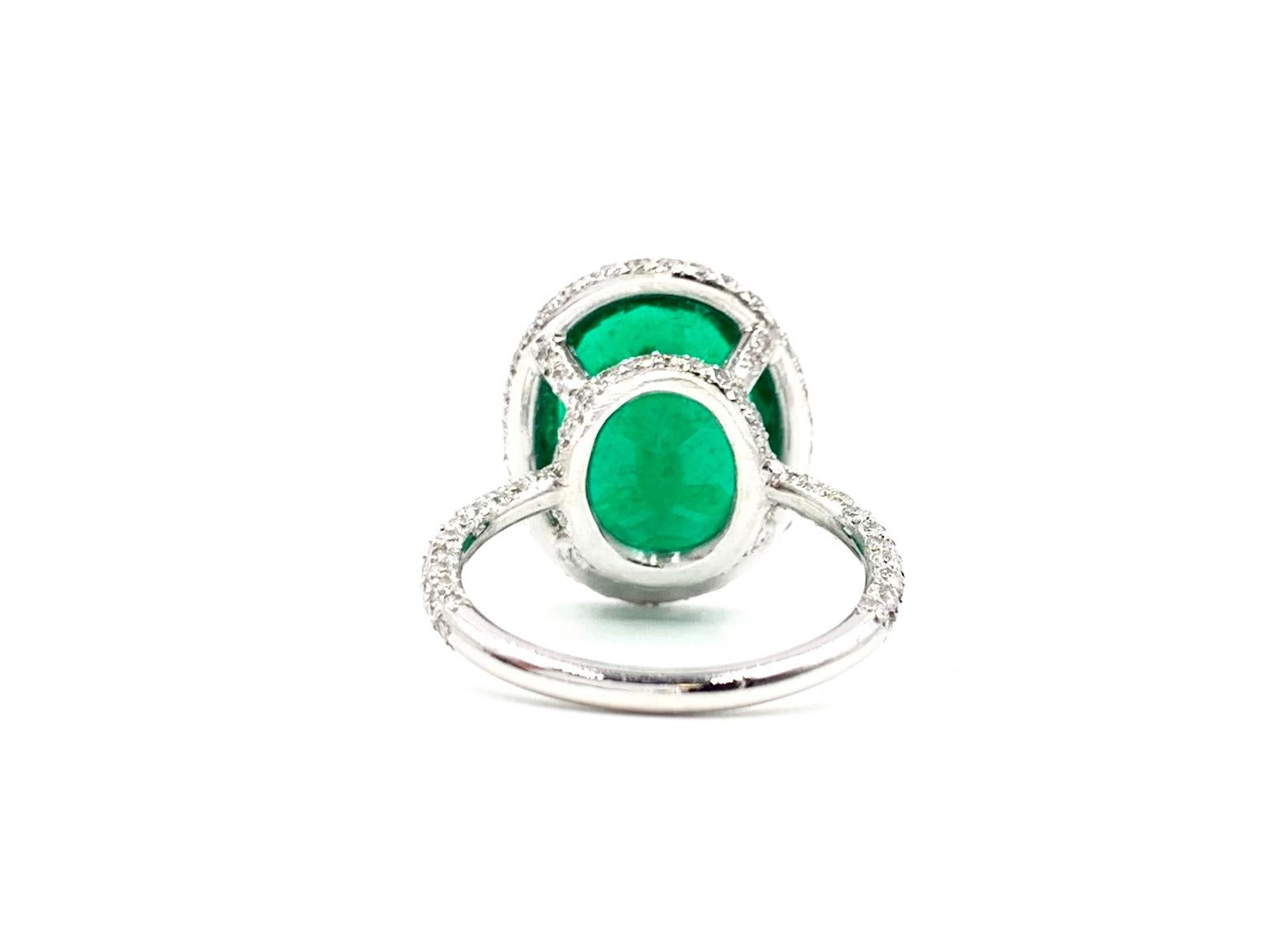 Oval Cut 5.79 Carat Emerald and Diamond Platinum Cocktail Ring