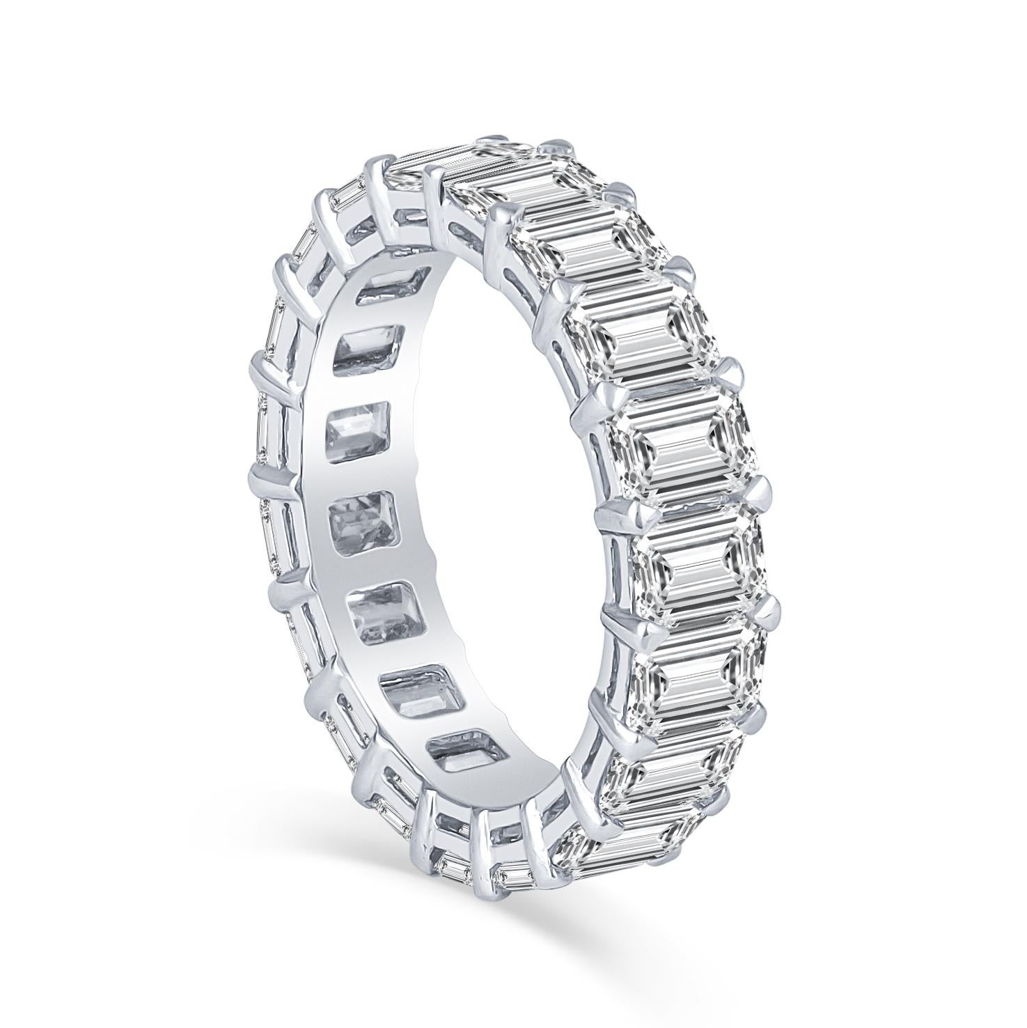 This 5.79ct total weight emerald cut diamond eternity band was custom manufactured in-house and each diamond was meticulously matched by our owners. The diamonds were sourced from the same supplier who supplies custom cut diamonds to some of the
