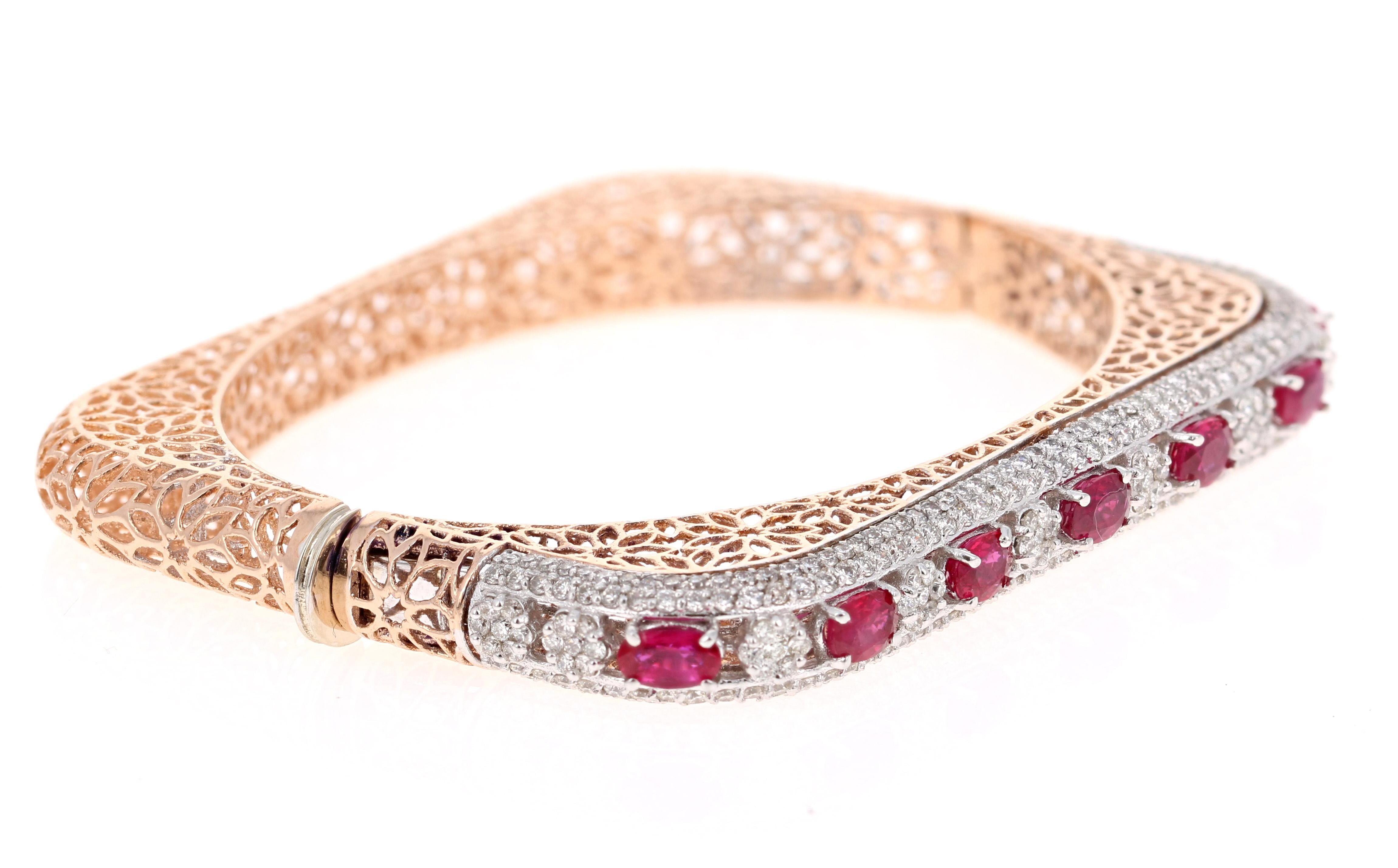 Stunning Statement Ruby Diamond Bangle! 

This Bracelet has 7 Natural Oval Cut Rubies that weigh 2.94 Carats. It also has 308 Round Cut Diamonds that weigh 2.85 Carats. The total carat weight of the bracelet is 5.79 Carats. (Clarity: VS, Color: