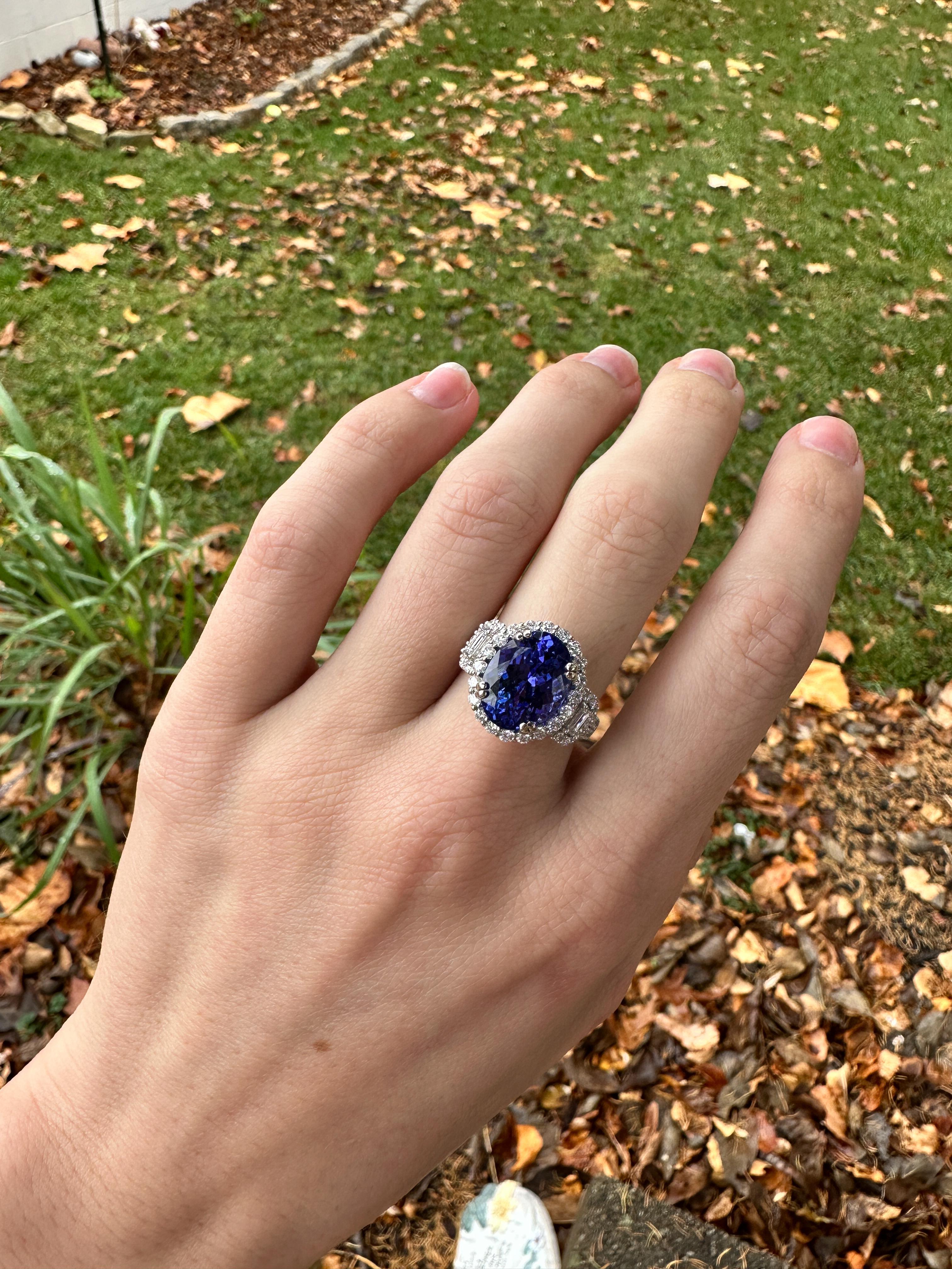 This gorgeous ring features a 5.67 carat oval Tanzanite gemstone with a halo of natural earth mined diamonds and pave diamond shank set in solid 14K white gold. This Tanzanite ring makes a lovely December birthstone gift for your loved ones!

**We