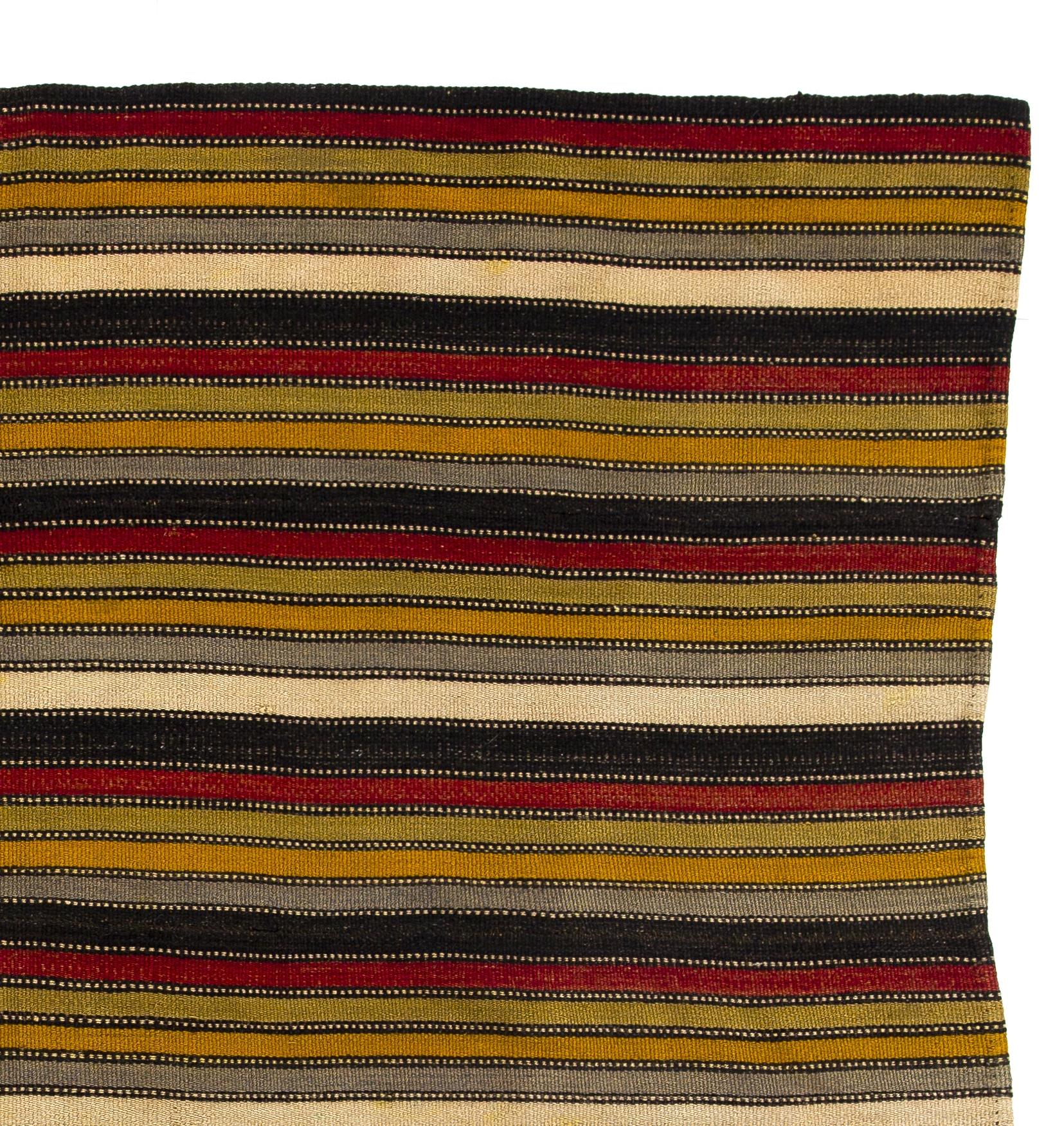 A vintage hand-woven rug from Eastern Turkey. It is made of naturally dyed wool. This type of Kilim were produced across Anatolia throughout 20th century for daily use rather than re-sale or export purposes and today they are quiet popular in