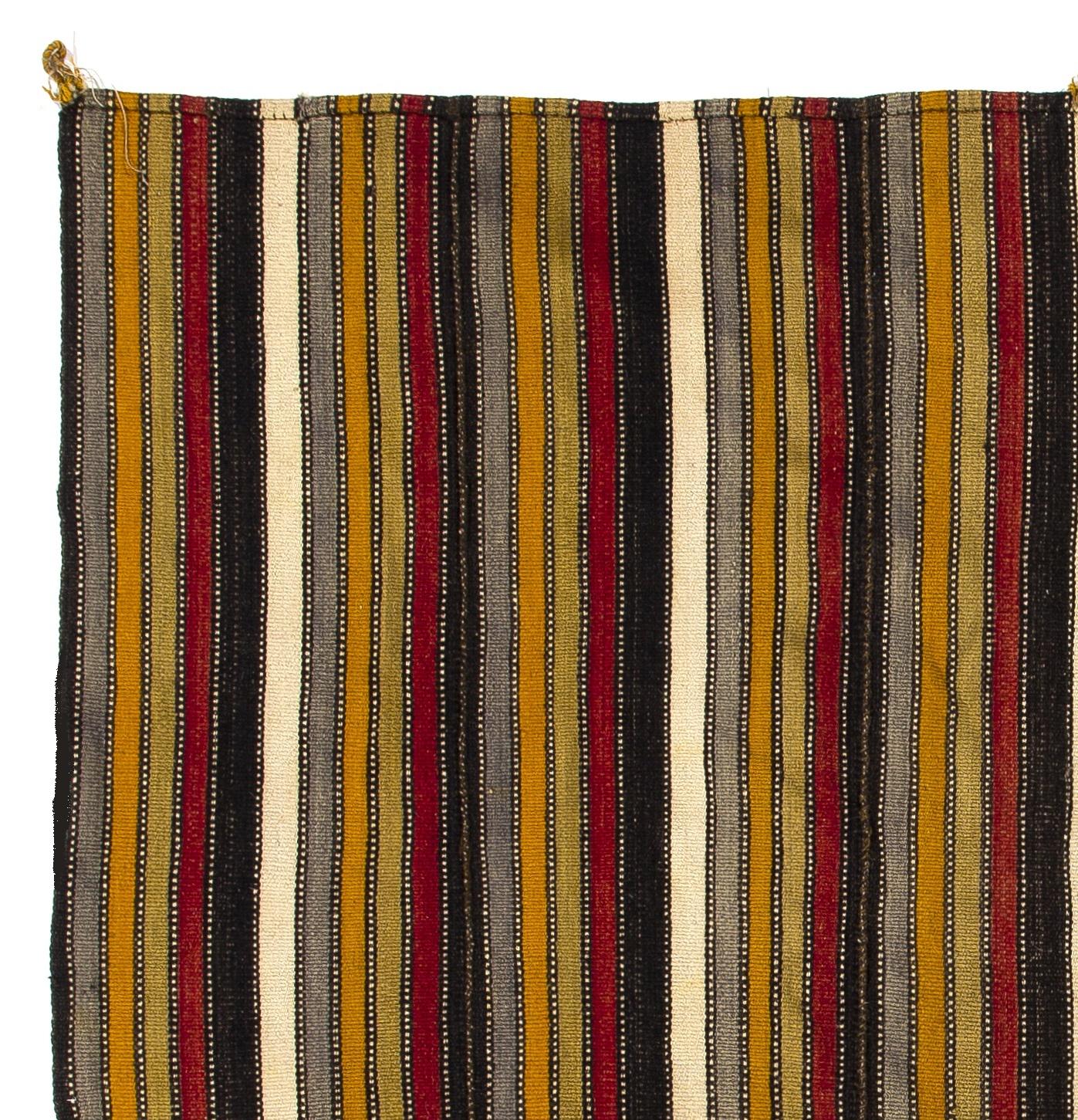 These authentic flat-weaves (Kilims) from Central Turkey were handwoven by Nomads to be used as a floor covering in their tents or summer houses until late 20th century. It is made of multi colored wool; the white stripes are of cotton. Measures: