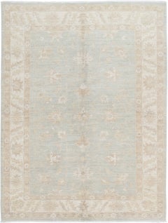 5.7x7.7 ft Hand Knotted Floral Area Rug with Light Blue Field and Ivory Border