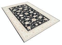 5.7x8 ft Hand Knotted Floral Area Rug with Black Field and Beige Border