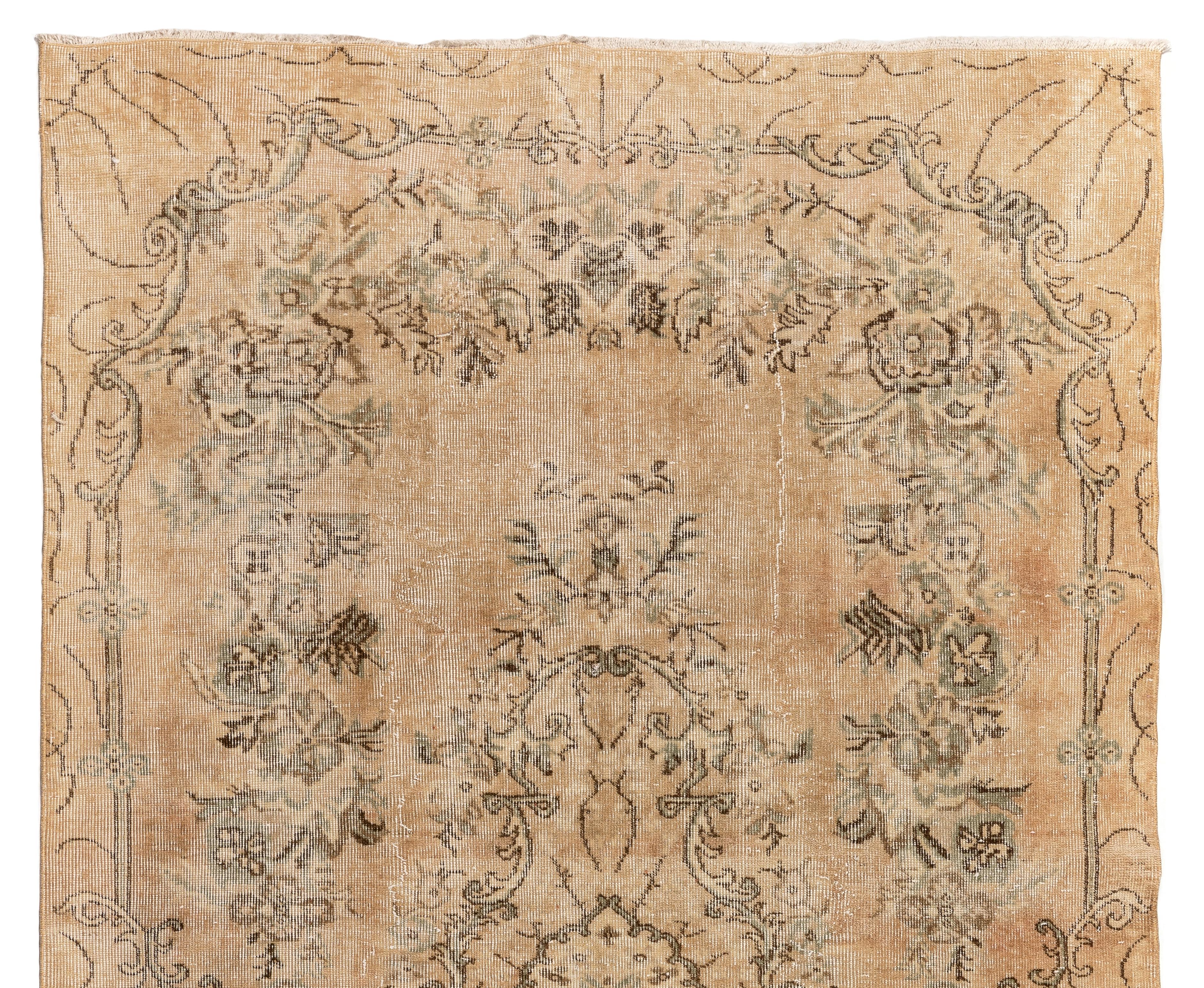 A finely hand knotted rug from Central Anatolia with soft neutral colors and low wool pile on cotton foundation. The rug is in very good condition and washed professionally. It is heavy and lays flat on the floor, suitable for both residential and