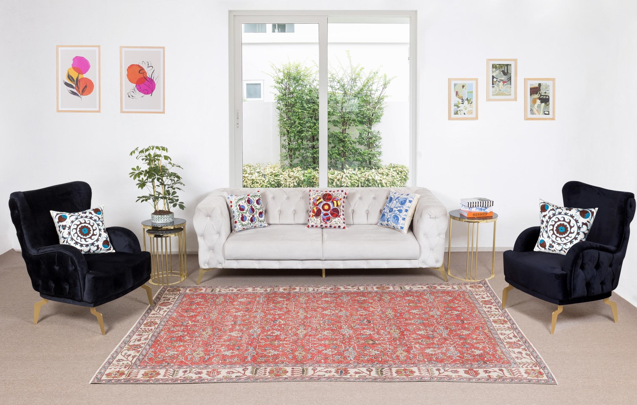 A finely hand-knotted vintage Turkish carpet from 1960s featuring a floral design. The rug has even low wool pile on cotton foundation. It is heavy and lays flat on the floor, in very good condition with no issues. It has been washed professionally,