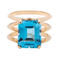 5.8 Carat Emerald Cut Blue Topaz Yellow Gold Triple Band Ring