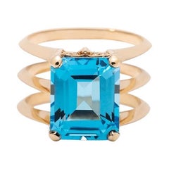 5.8 Carat Emerald Cut Blue Topaz Yellow Gold Triple Band Ring