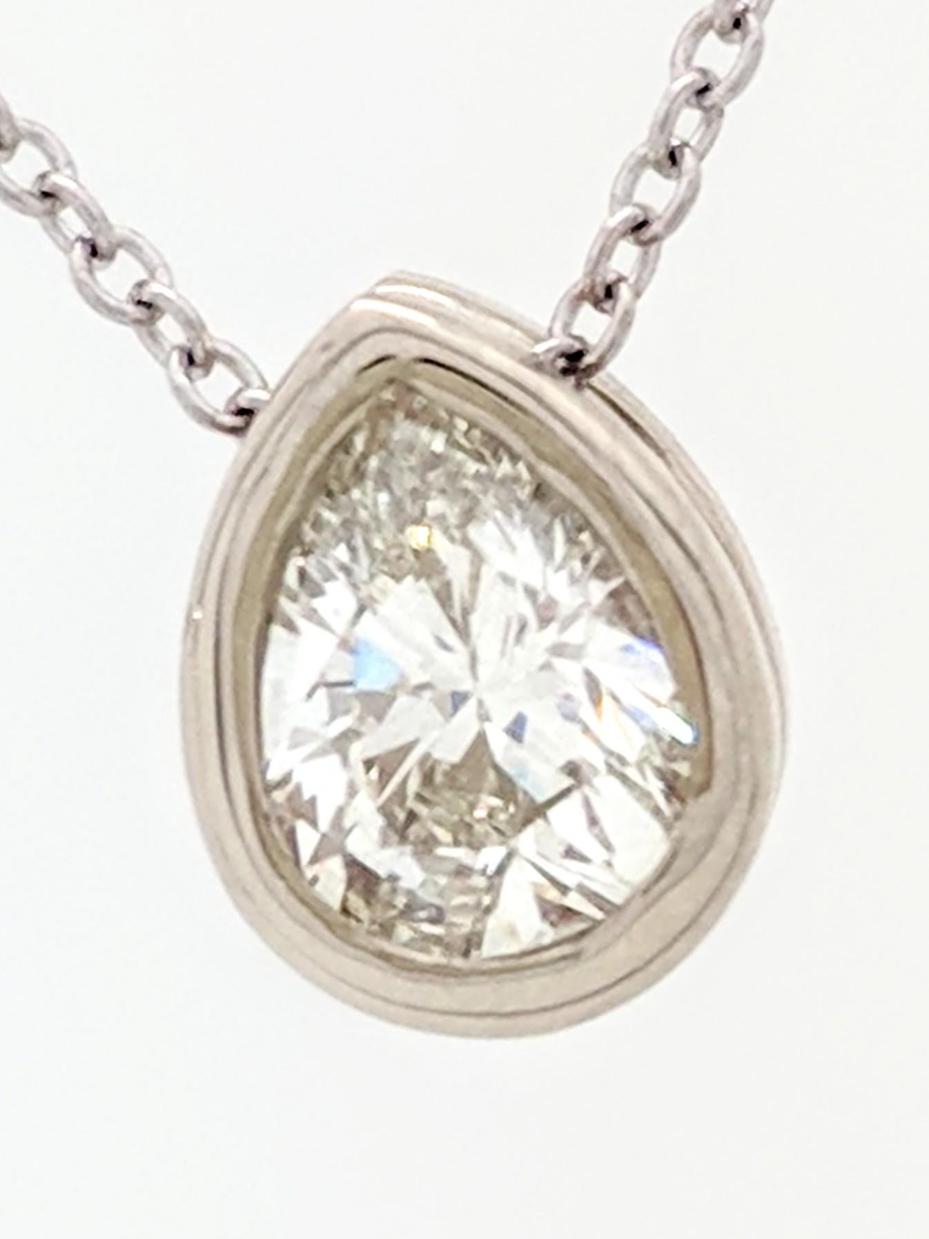 You are viewing a stunning .58ct. natural pear cut diamond. We estimate this diamond to be SI1 in clarity and H color. The diamond is beautifully displayed in a brand new 14kwg bezel set mounting attached to a new 18