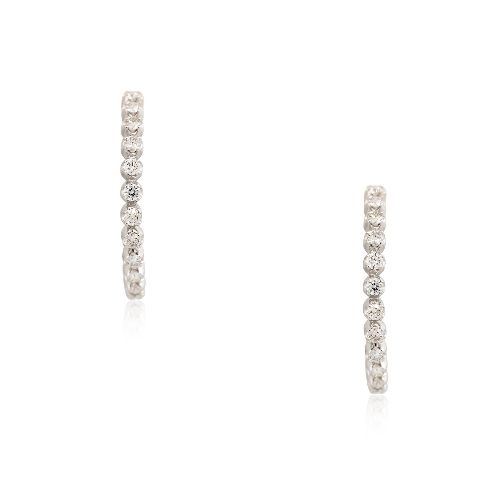 With 44 round brilliant cut diamonds, weighing approximately 5.88 carats total, this pair of inside out diamond hoops are what every woman needs! This pair of earrings would be a great addition to anyone's collection, especially someone who loves