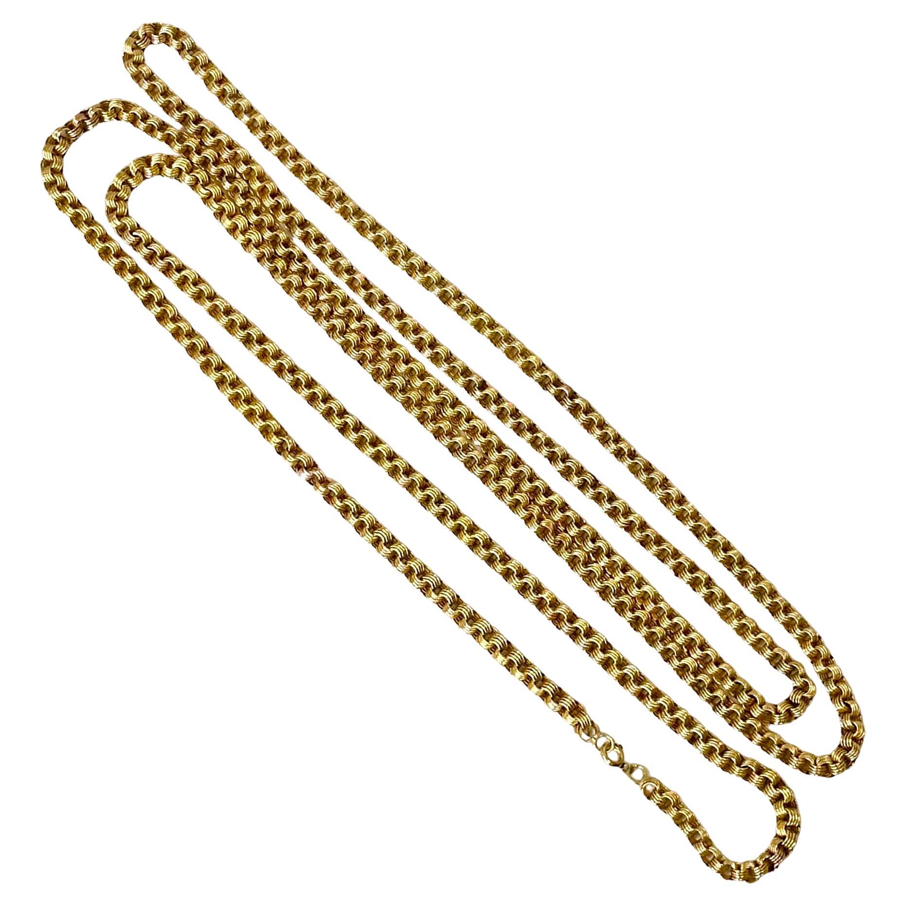 With a length of 58 inches, this expertly crafted early 20th century 14k yellow gold link neck chain lends itself to being worn in a number of different configurations; in one long, continuous length, doubled up, or even tripled up around the neck.