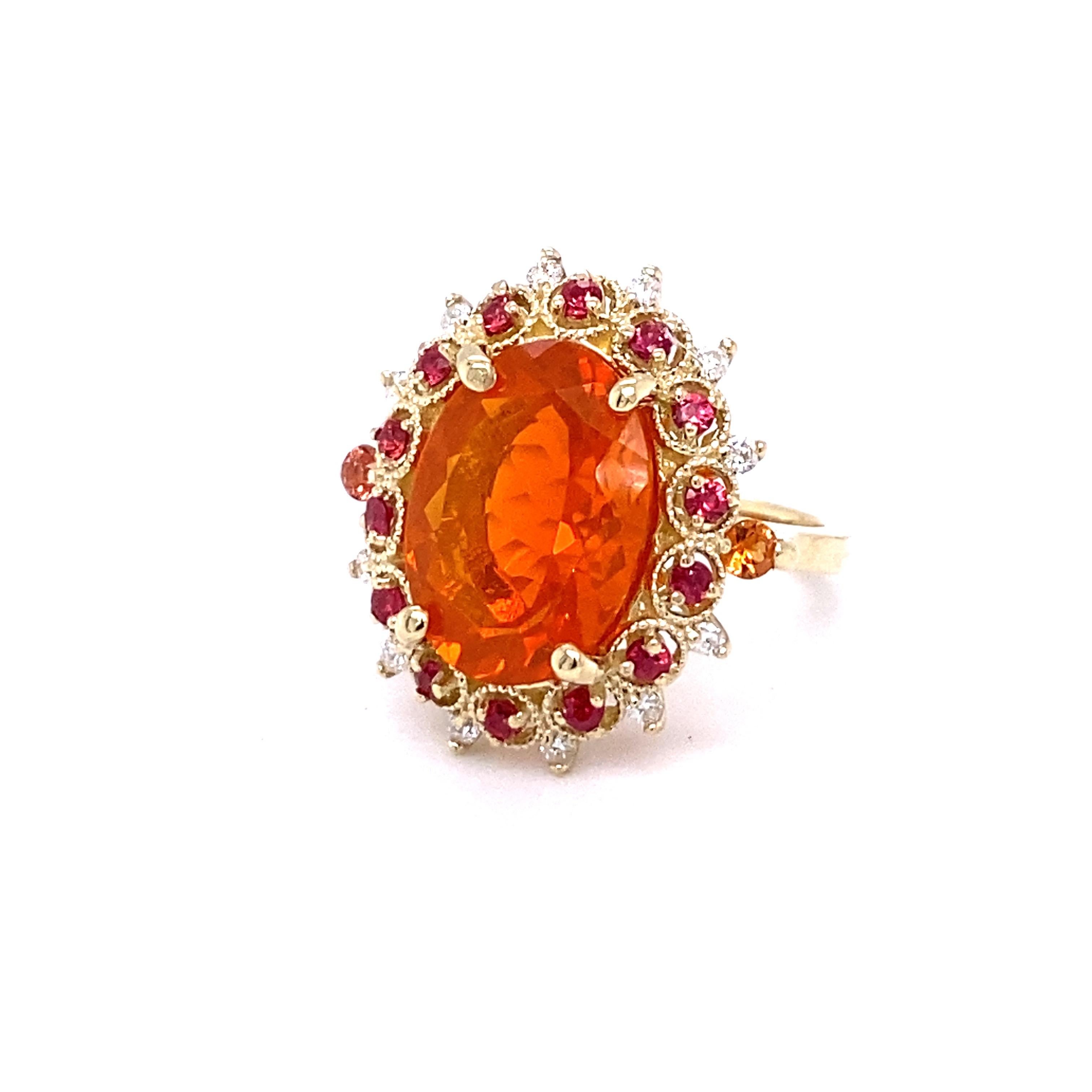 Beautiful and uniue Fire Opal and Diamond ring with a touch of Sapphires!!

Item specs:

Fire Opal/4.94cts
12 Round Cut Diamonds/0.20ct
14 Red Sapphires/0.49ct
2 Orange Sapphires/0.17ct
14KY Gold/approx. 6.3grams

Total Carat weight of the ring is