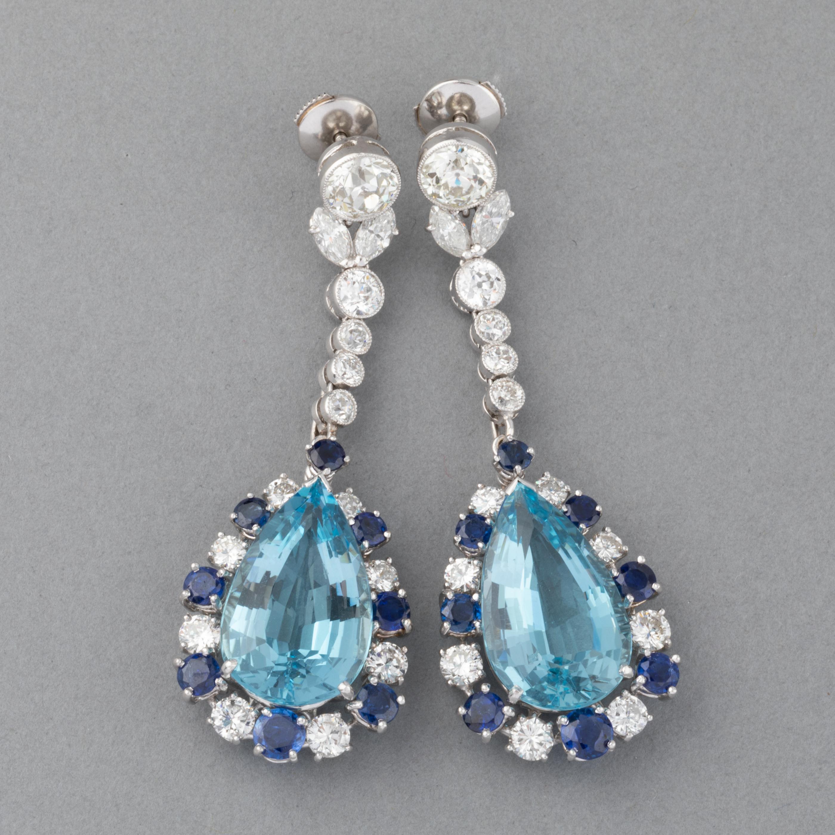 Very beautiful pair of earrings, made in France circa 1960.

They are big: 5.80 cm height of 2.32 inches
Made in white gold 18k for the system, platinum for the diamonds part, gold 14k for the aquamarine cluster. 
The two principal diamonds weights 