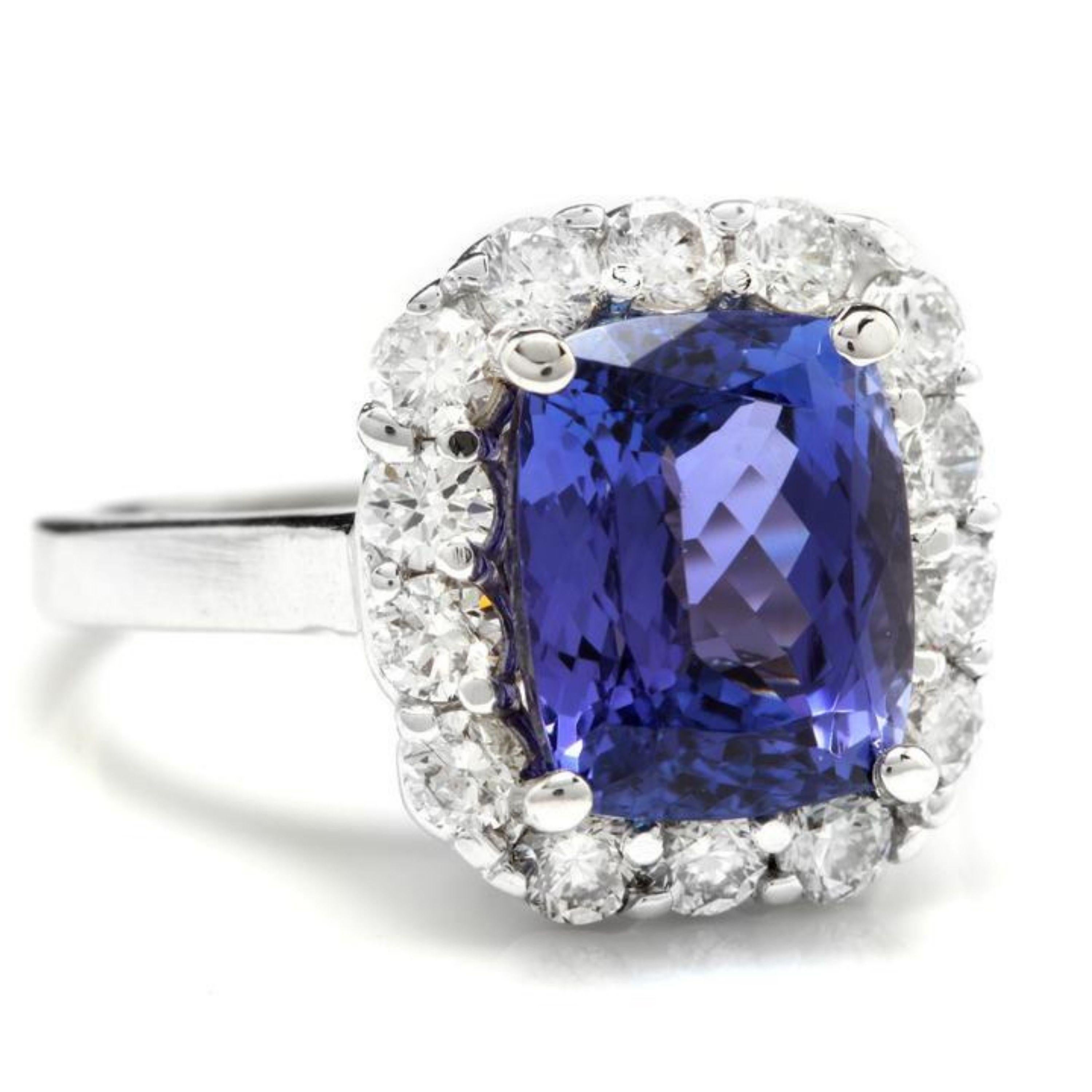 5.80 Carats Natural Very Nice Looking Tanzanite and Diamond 14K Solid White Gold Ring

Total Natural Cushion Cut Tanzanite Weight is: Approx. 4.65 Carats

Tanzanite Measures: Approx. 11 x 8.06mm

Tanzanite Treatment: Heat

Natural Round Diamonds