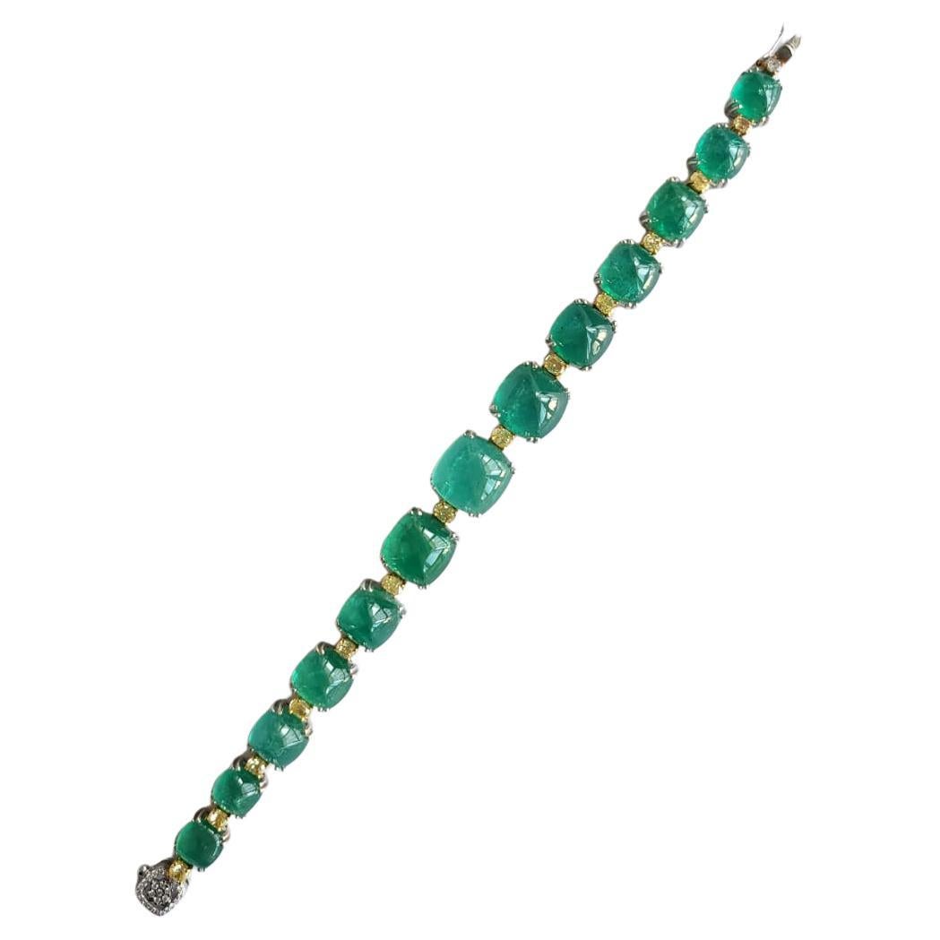 A very gorgeous and beautiful Emerald Link Bracelet set in 18K White Gold & Diamonds. The weight of the Emerald sugarloafs is 58.07 carats. The Emeralds are completely natural, without any treatment and is of Zambian origin. The weight of the