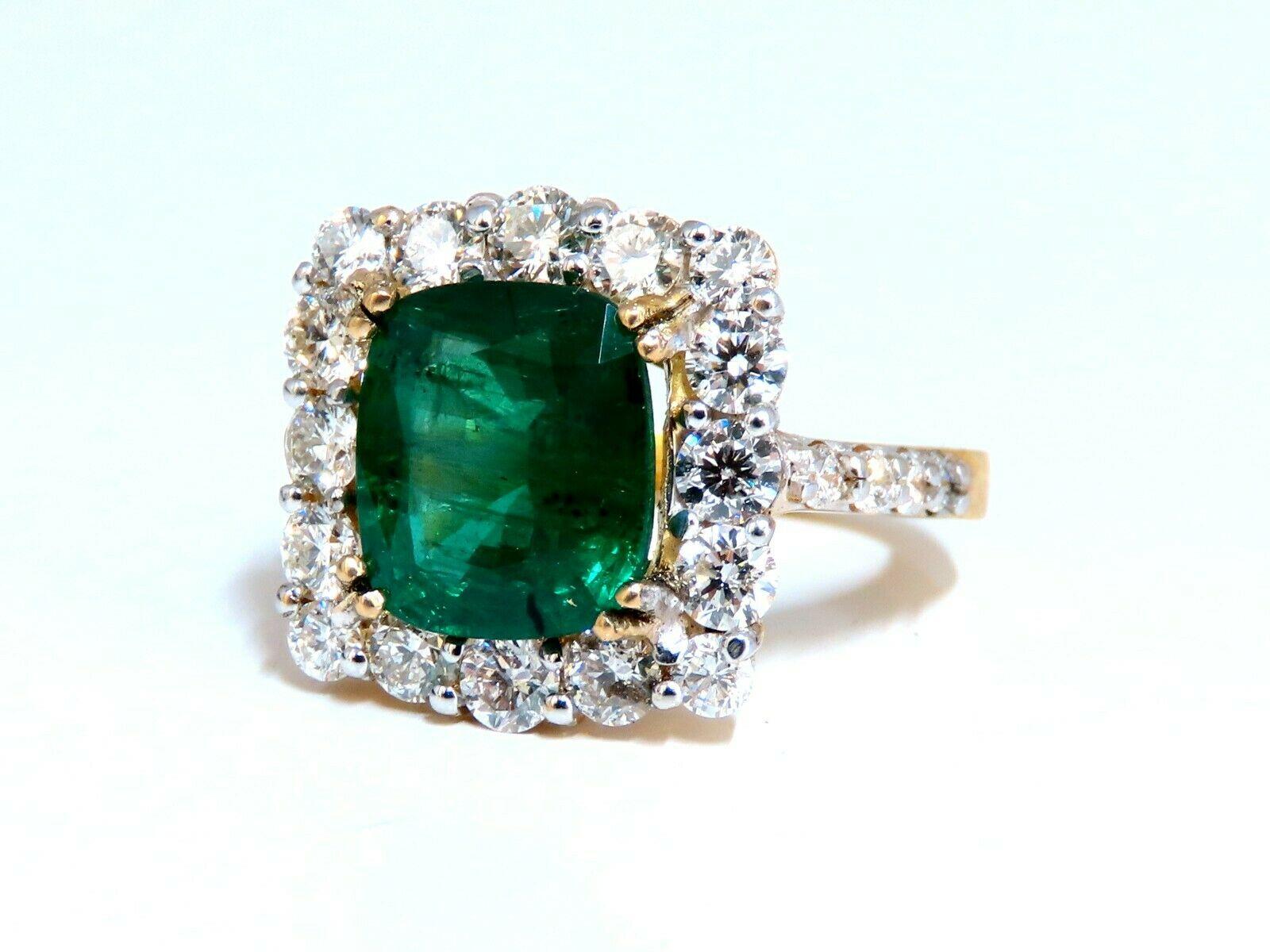Squared Halo Cluster Green.

3.80ct. Natural Emerald Ring

Emerald, Brilliant cut

10.7 x 8.9mm Diameter

Transparent & Vivid Green 

2.00ct. Diamonds.

Rounds & full cuts 

G-color Vs-2 clarity.  

14kt. yellow gold

8.2 grams

Ring Current size: