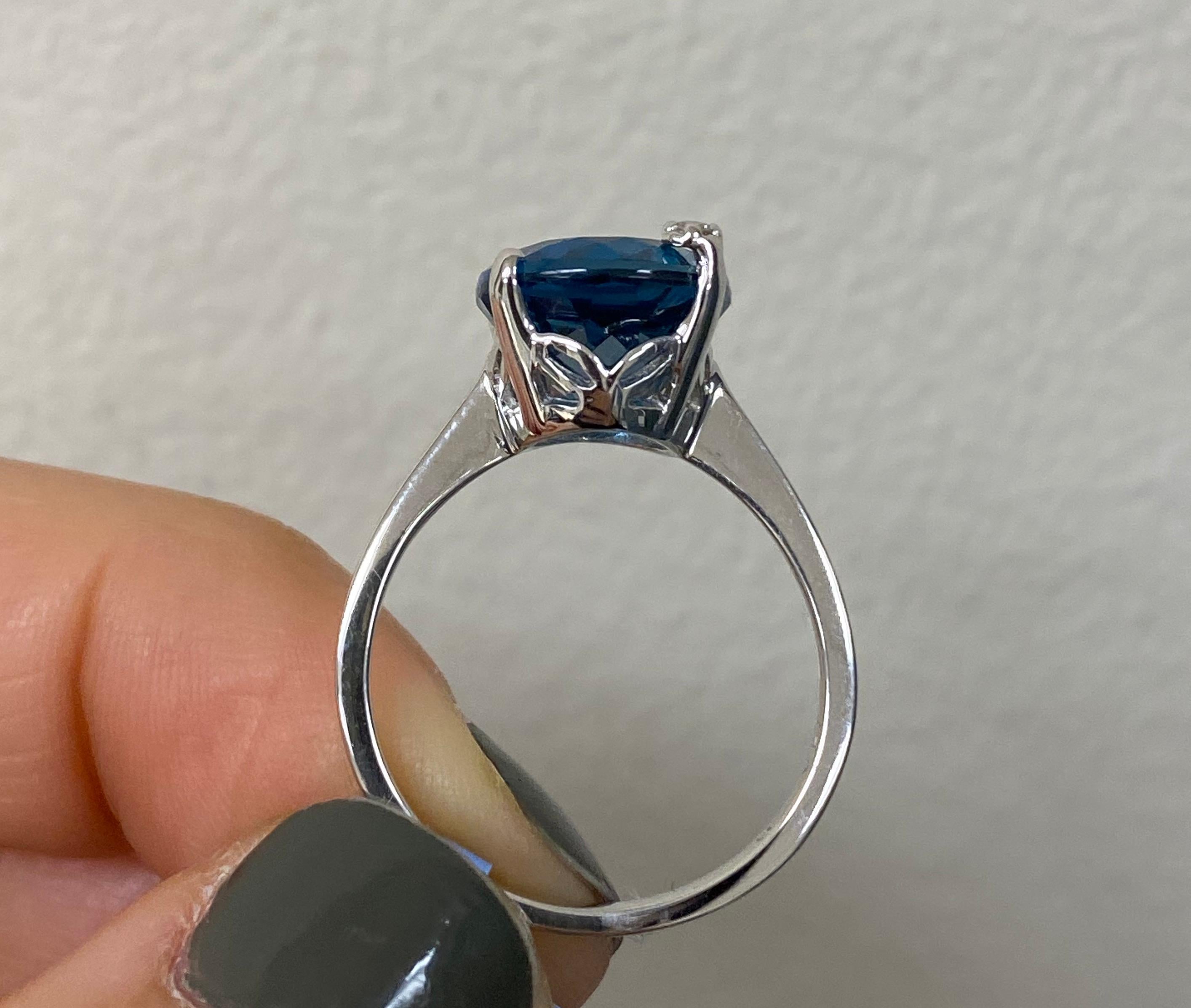 Oval Cut 5.81 Carat Blue Topaz and Diamond Ring