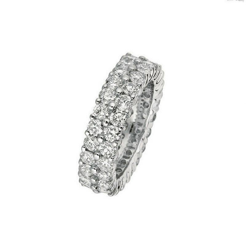 100% Natural Diamonds, Not Enhanced in any way Diamond Band 
5.81CT
G-H 
SI  
18K White Gold,  Prong set,  8.90 grams
7 mm in width 
Size 7
44 diamonds

RT62WD18K
ALL OUR ITEMS ARE AVAILABLE TO BE ORDERED IN 14K WHITE, ROSE OR YELLOW GOLD UPON
