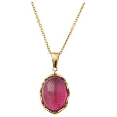 5.81 Carat Cabochon Dark Pink Tourmaline Pendant in 14 Karat Yellow Gold, Chain