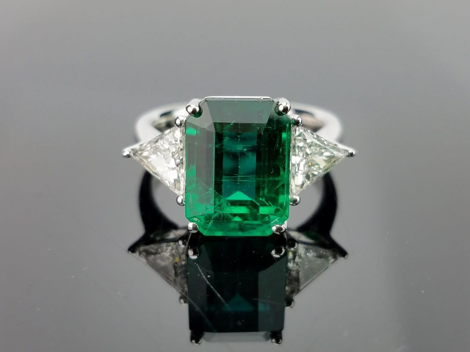 Emerald Cut 5.82 Carat Emerald and Diamond Three-Stone Engagement Ring