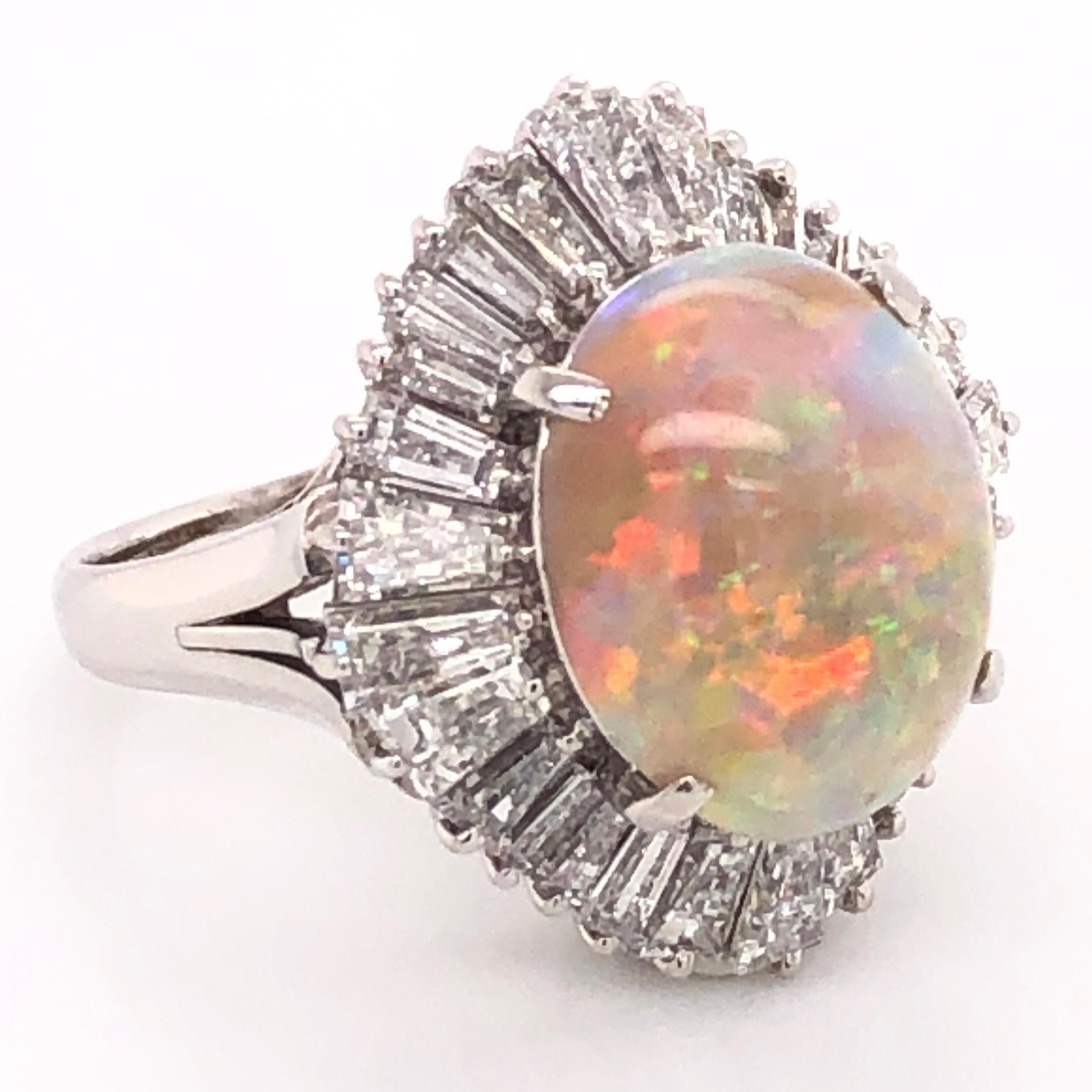 Simply Beautiful! Finely detailed Ballerina Vintage Platinum Cocktail Ring. Centering a securely nestled Hand set Australian White Opal, weighing 5.82 Carats, surrounded by Diamonds, approx. 2.81tcw. Hand crafted Platinum mounting. Size 6, we offer