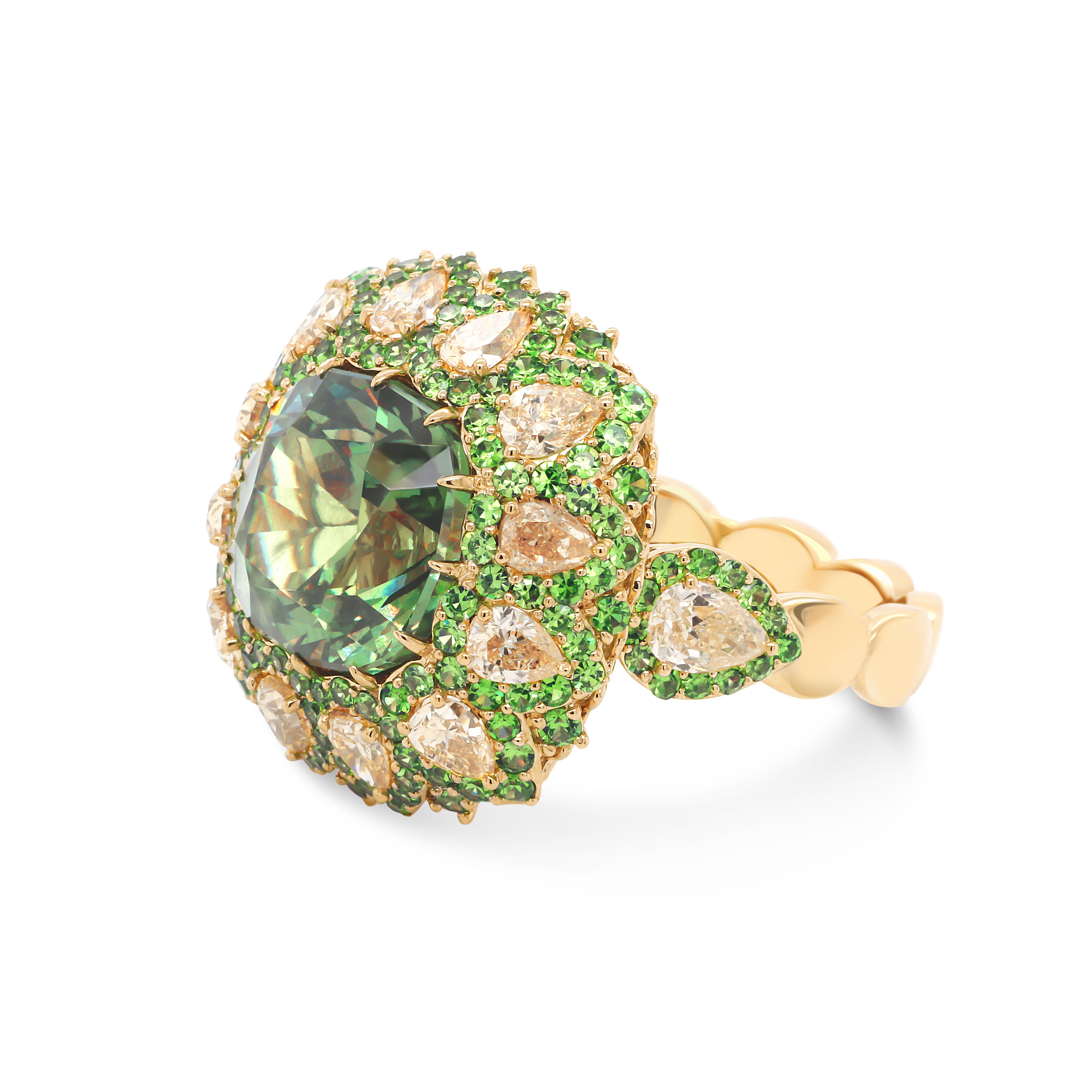 Luxurious 18 Karat Gold Ring featured rare 5.82 ct Russian Demantoid accented with Yellow pear cut Diamonds 1.48 ctw and round Demantoids 1.11 ctw. 
Demantoid is called a star of garnets, it's name means diamond-like stone and it's truly is! An