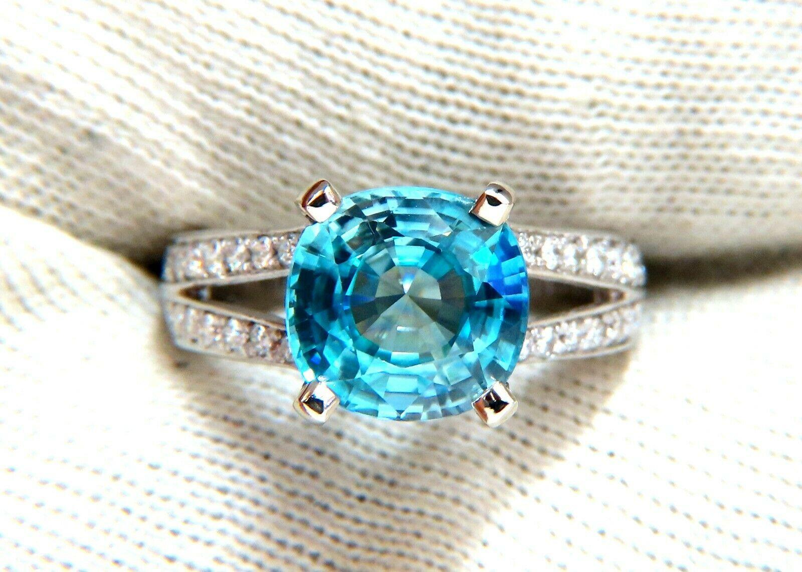 Indigo Blue Natural Zircon Ring

5.02ct. Natural Blue Zircon

Cushion cut

9.5 X 9.8mm

 VS Clean Clarity, Transparent



.80ct Side Full cut natural round diamonds

 G-colors & Vs-2 clarity

  14kt. white gold

6.8 grams

Ring Current size:
