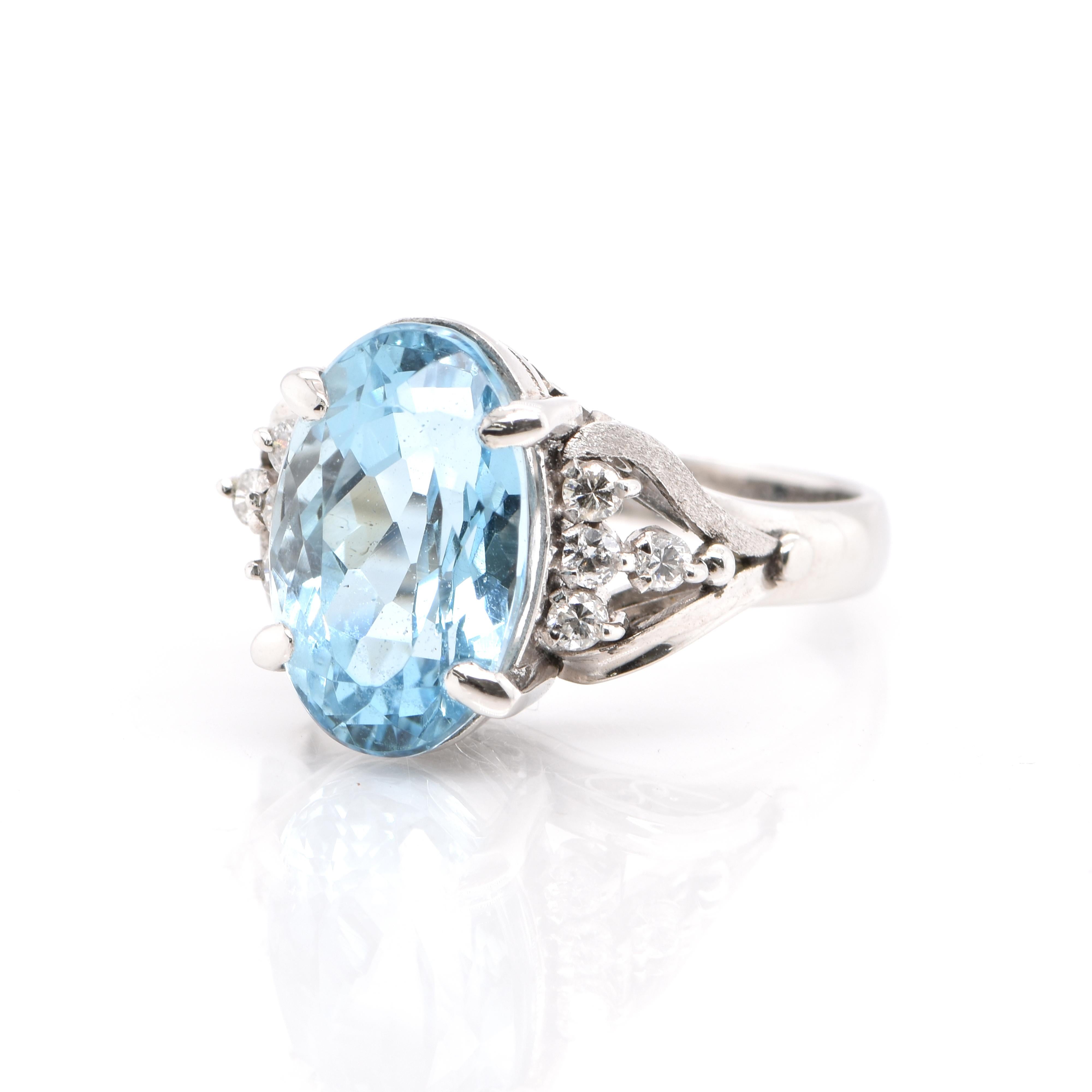 A beautiful, Estate Cocktail ring with a 5.83 Carat Santa-Maria Aquamarine and 0.22 Carats of White Round Brilliant Diamond Accents set in Platinum. Aquamarines have been prized gems throughout human history for their cool blue color. They