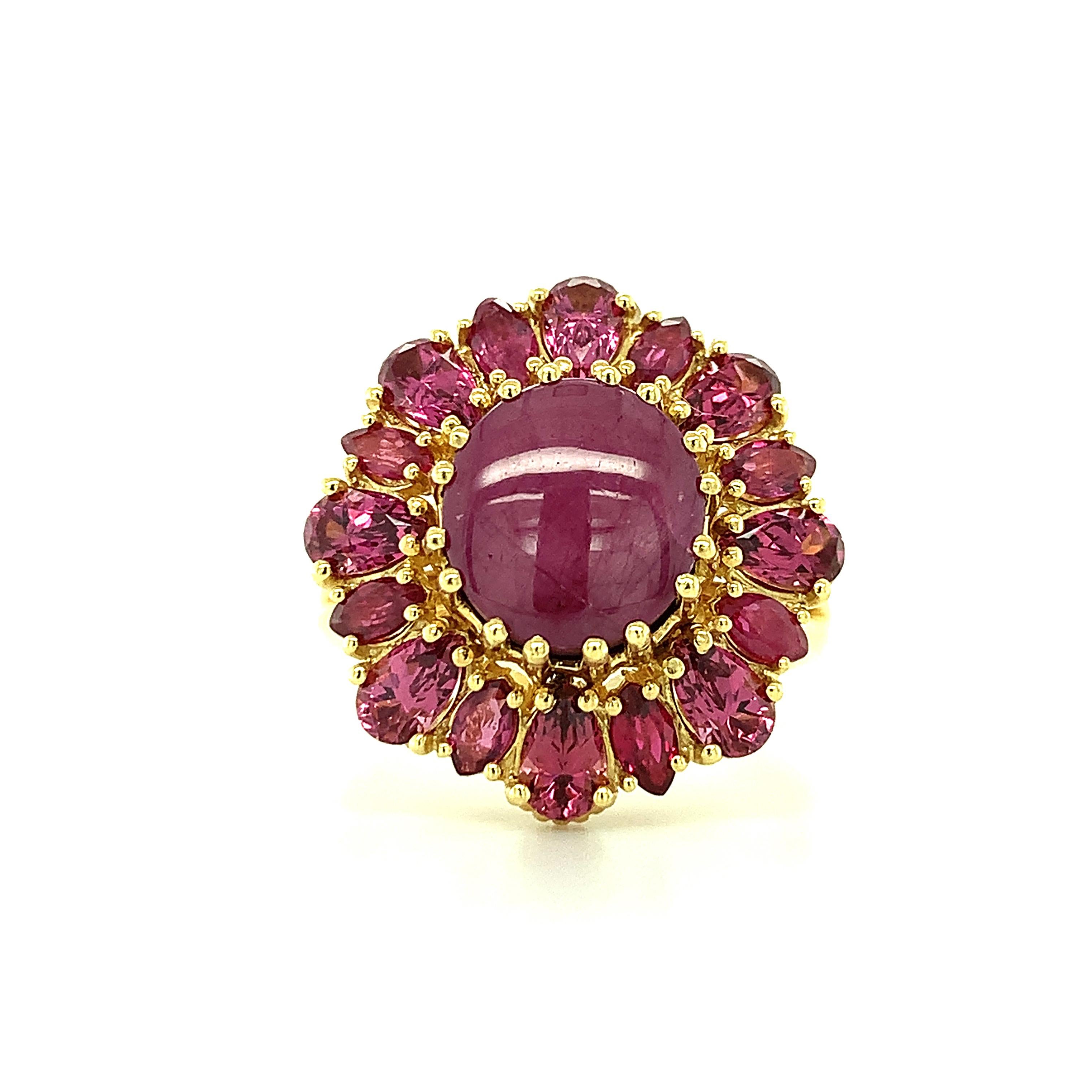 This starburst cocktail ring features a strawberry milkshake-color star ruby, artfully framed by coordinating pear shaped, pink rose colored rhodolite garnets and marquise shaped rubies. Handmade in 18k yellow gold in our signature retro-style ring