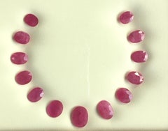 58.39 Carats Ruby Mozambique Oval Faceted Cut stone Layout Heated Natural Gem