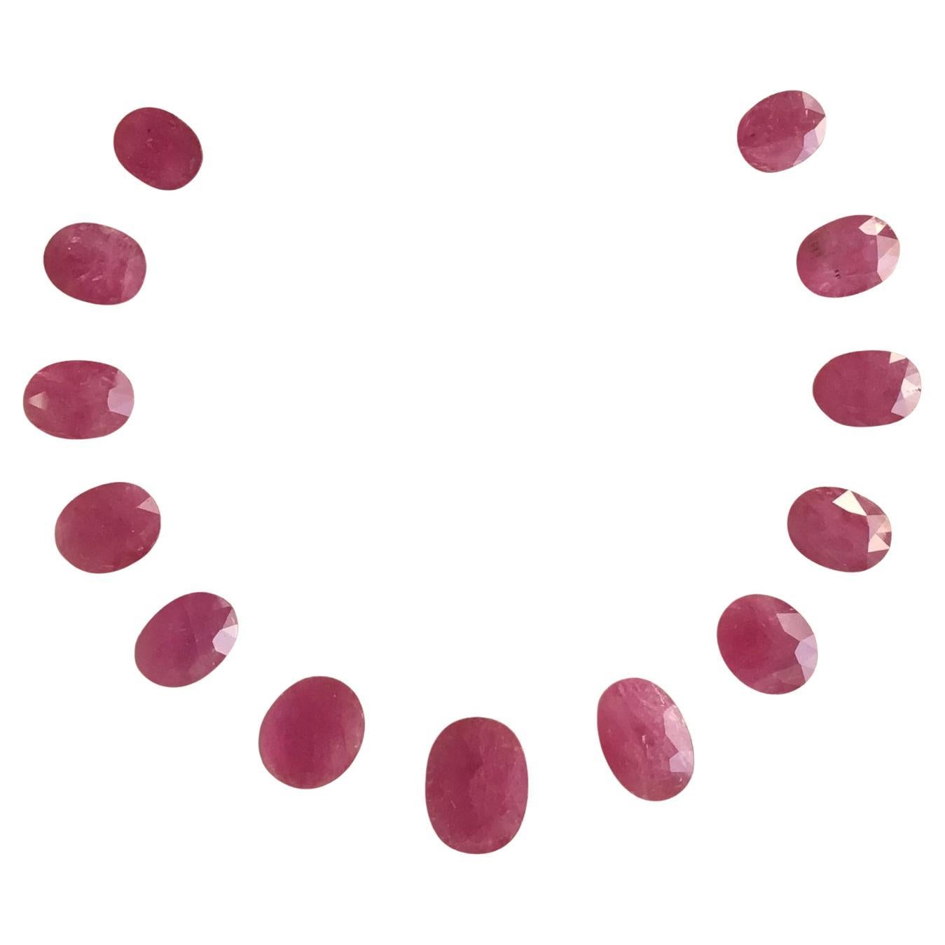 58.39 Carats Ruby Mozambique Oval Faceted Cut stone Layout Heated Natural Gem