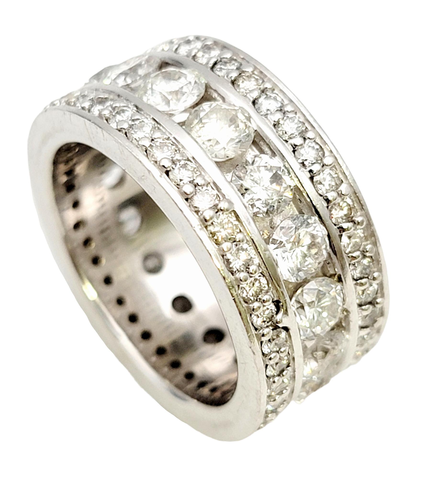 Ring size: 8.75

Absolutely spectacular multi-row diamond eternity band ring. This remarkable ring features a full circle of icy white round diamonds that truly shimmer and shine from every angle. The wider band style enhances the incredible